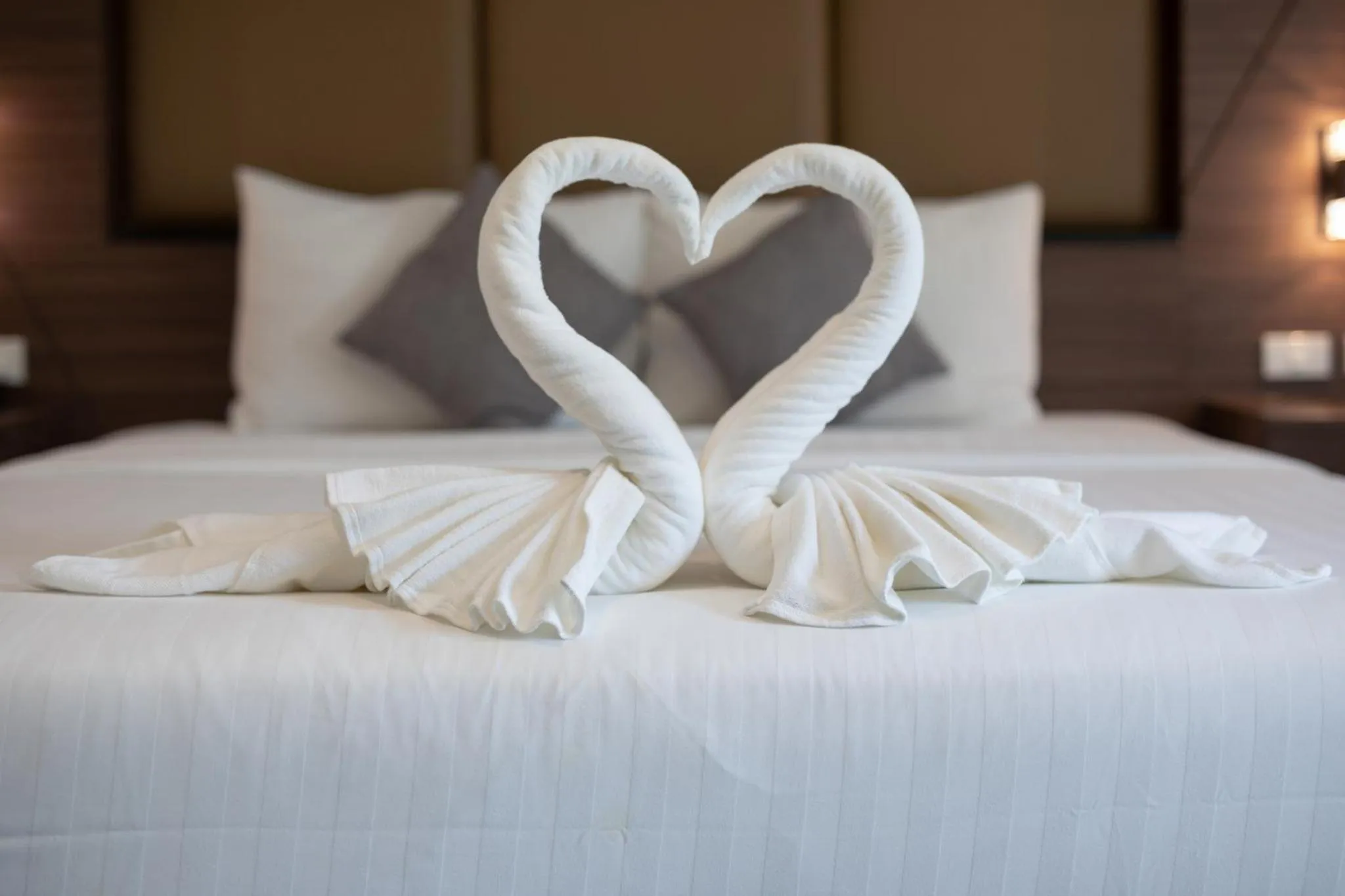 towels, Bed in The Bell Airport Phuket Hotel - SHA Extra Plus