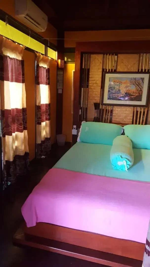 Bed in T Star Cottage Langkawi Bed in T Star Cottage Langkawi