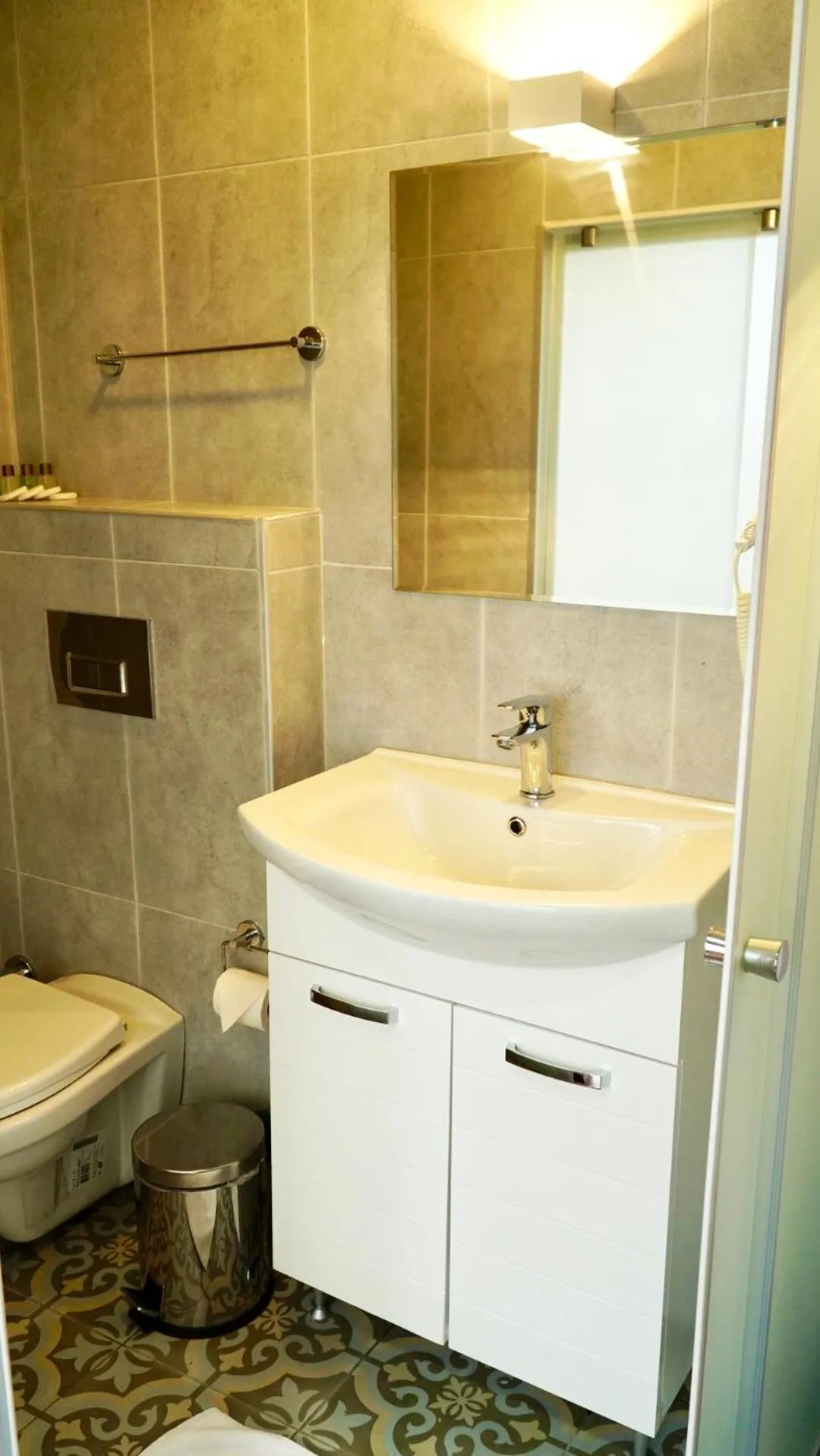 Toilet in QONAQ HOTEL & SUITES