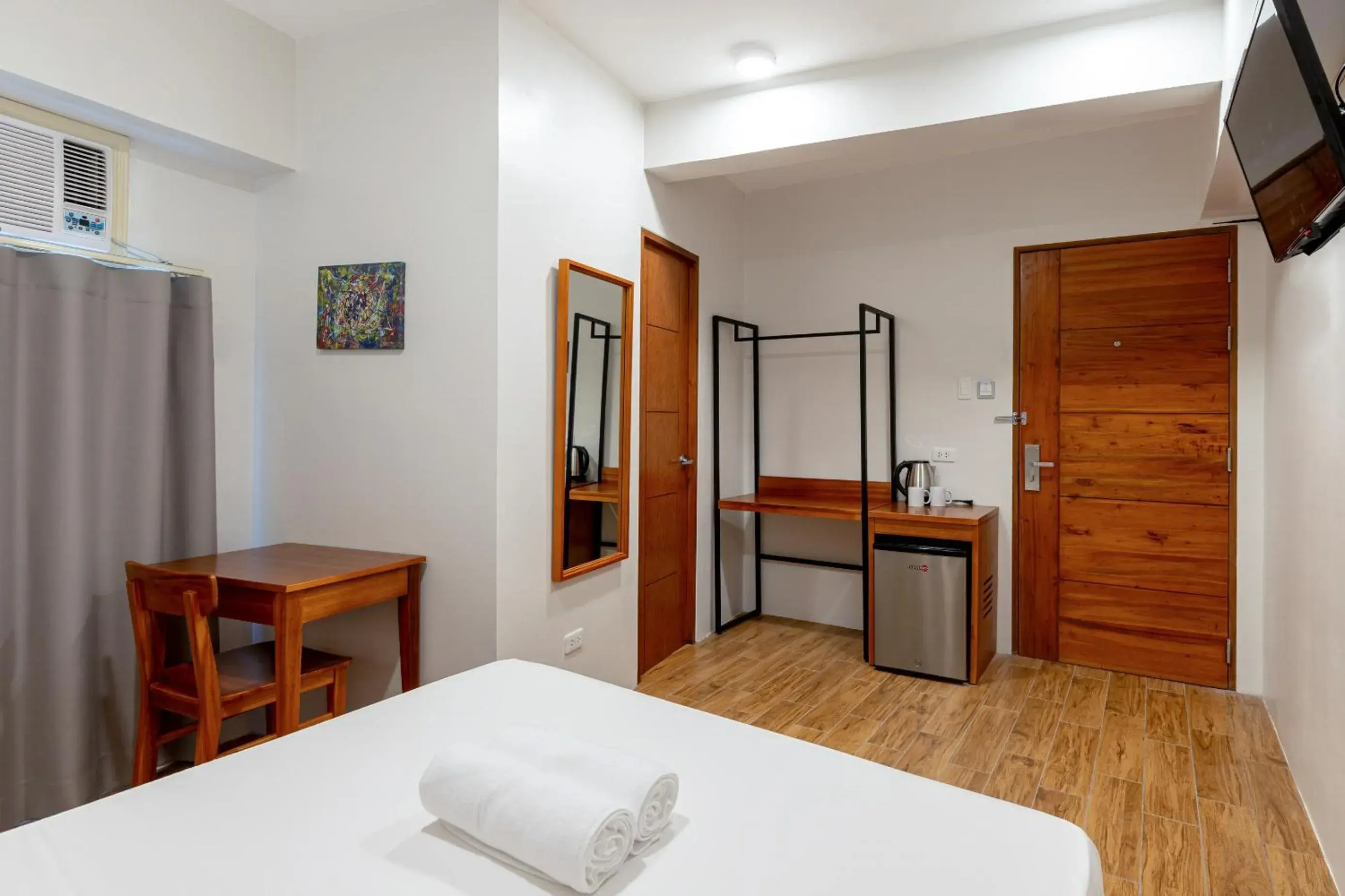 wardrobe, Bed in iHotel Uptown BGC wardrobe, Bed in iHotel Uptown BGC