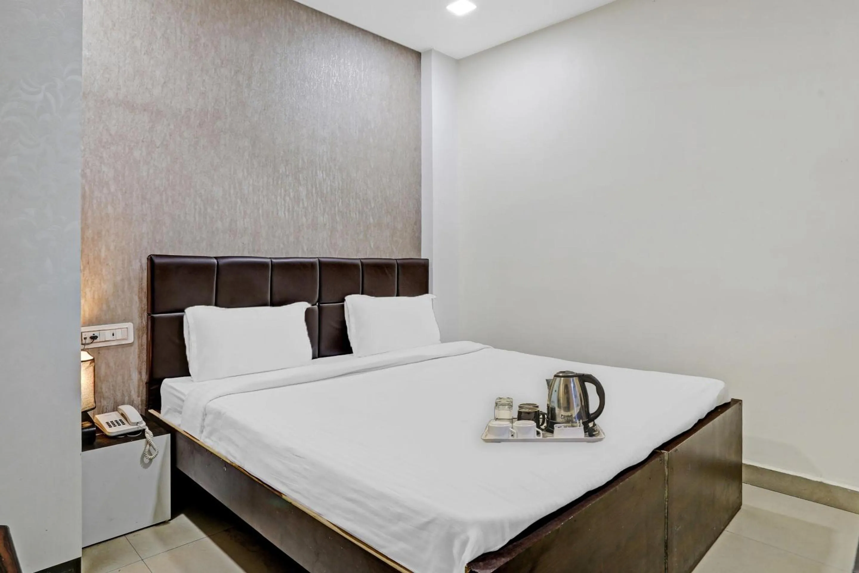 Bedroom in Hotel O Happy Stay