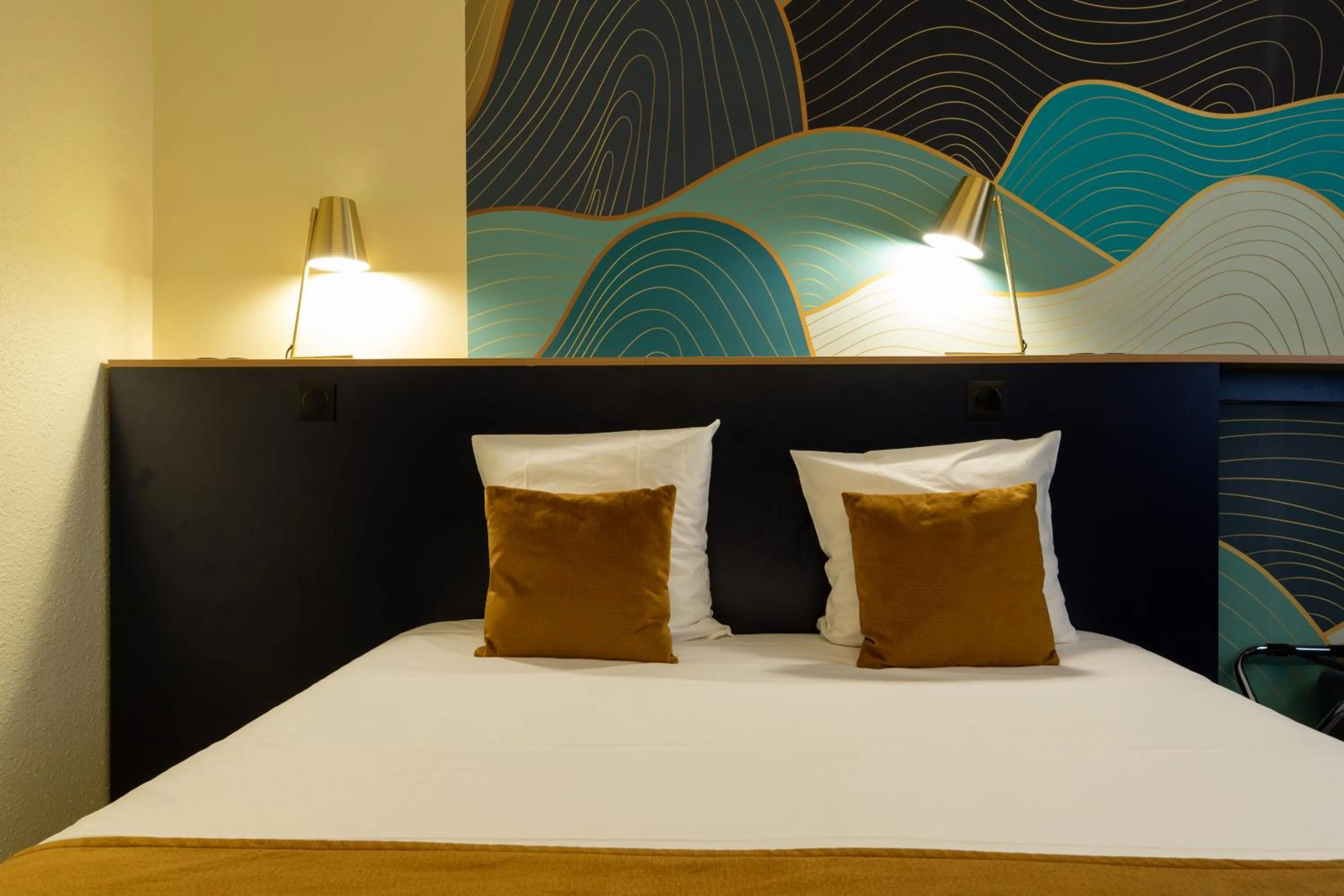 Bed in Logis Hôtel du Haut-Bugey