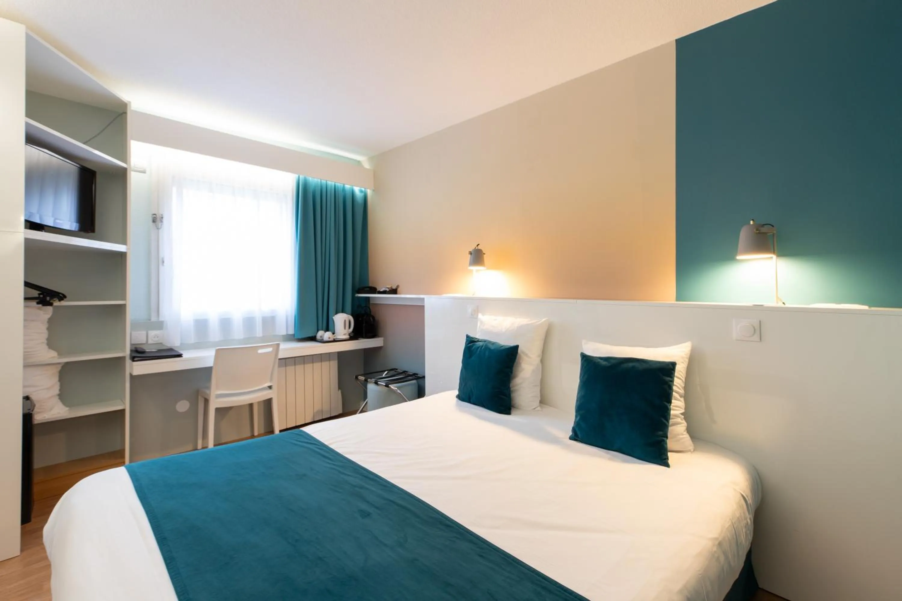 Bed in Logis Hôtel du Haut-Bugey