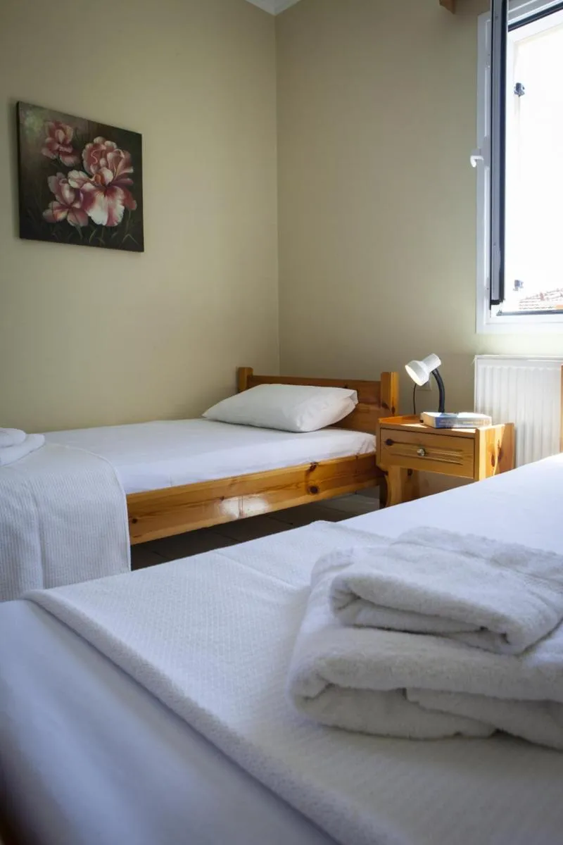 Bed in Kantouni Apartments