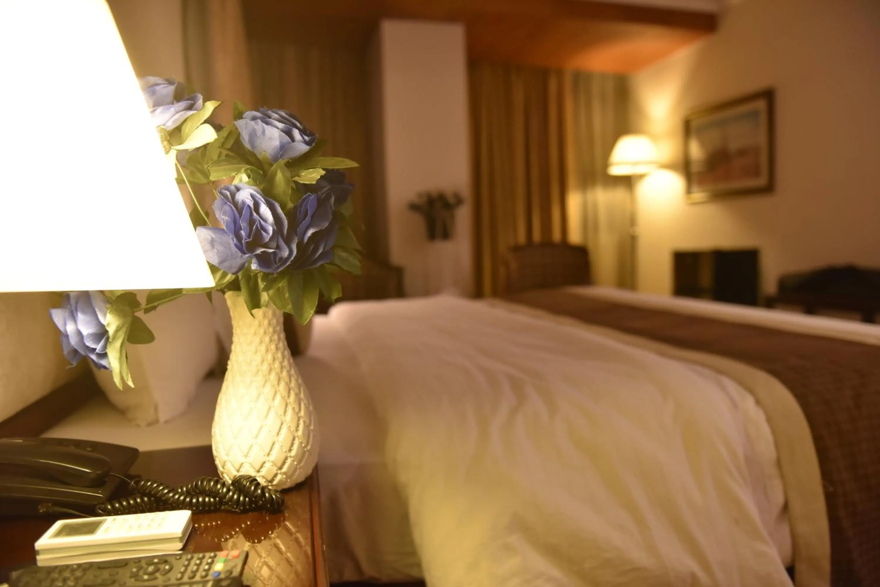 Bed in Shalimar Tower Hotel Lahore