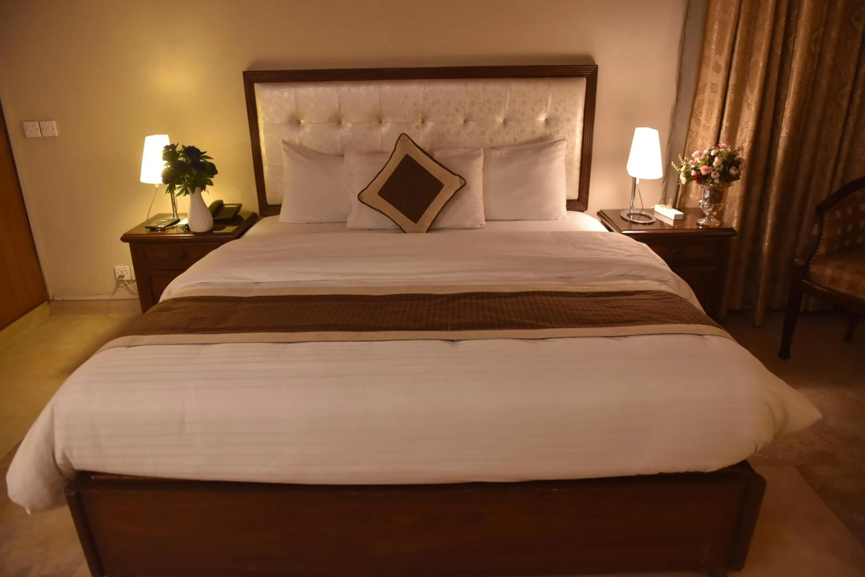 Bed in Shalimar Tower Hotel Lahore