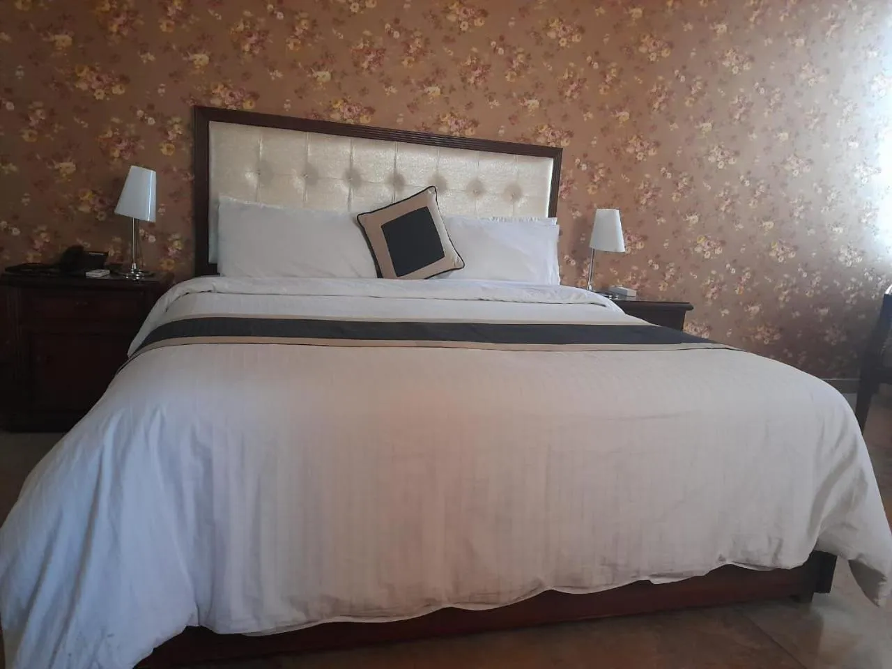 Bed in Shalimar Tower Hotel Lahore