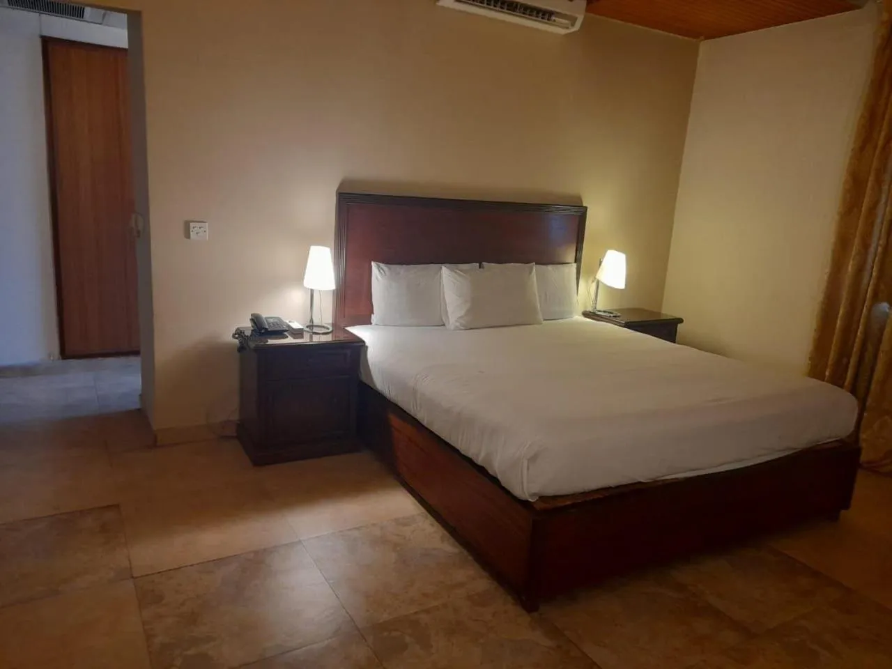 Bed in Shalimar Tower Hotel Lahore