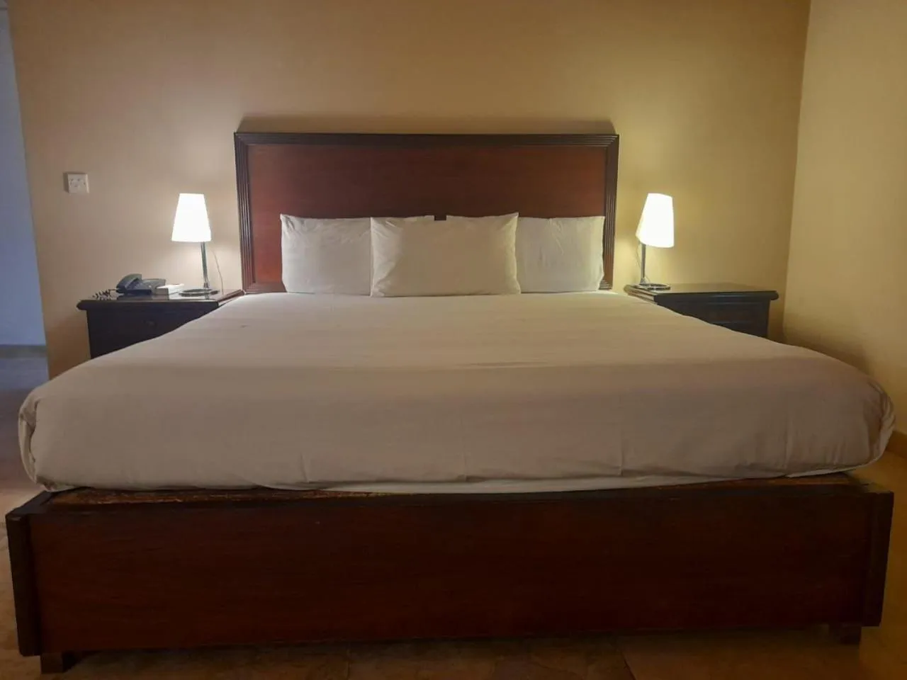 Bed in Shalimar Tower Hotel Lahore