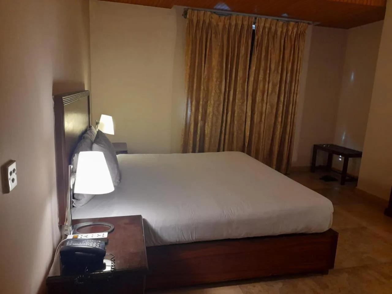 Bed in Shalimar Tower Hotel Lahore