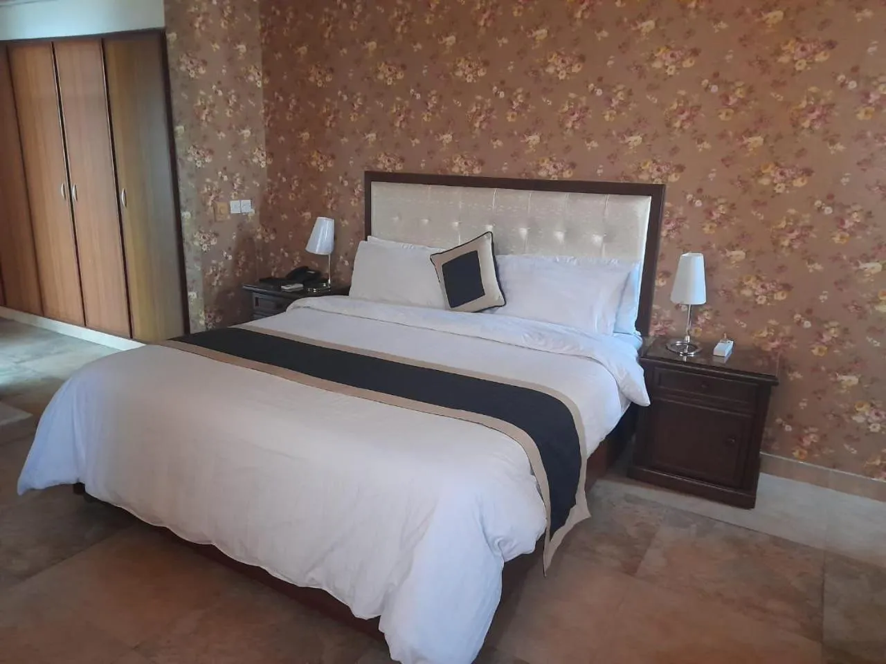 Bed in Shalimar Tower Hotel Lahore