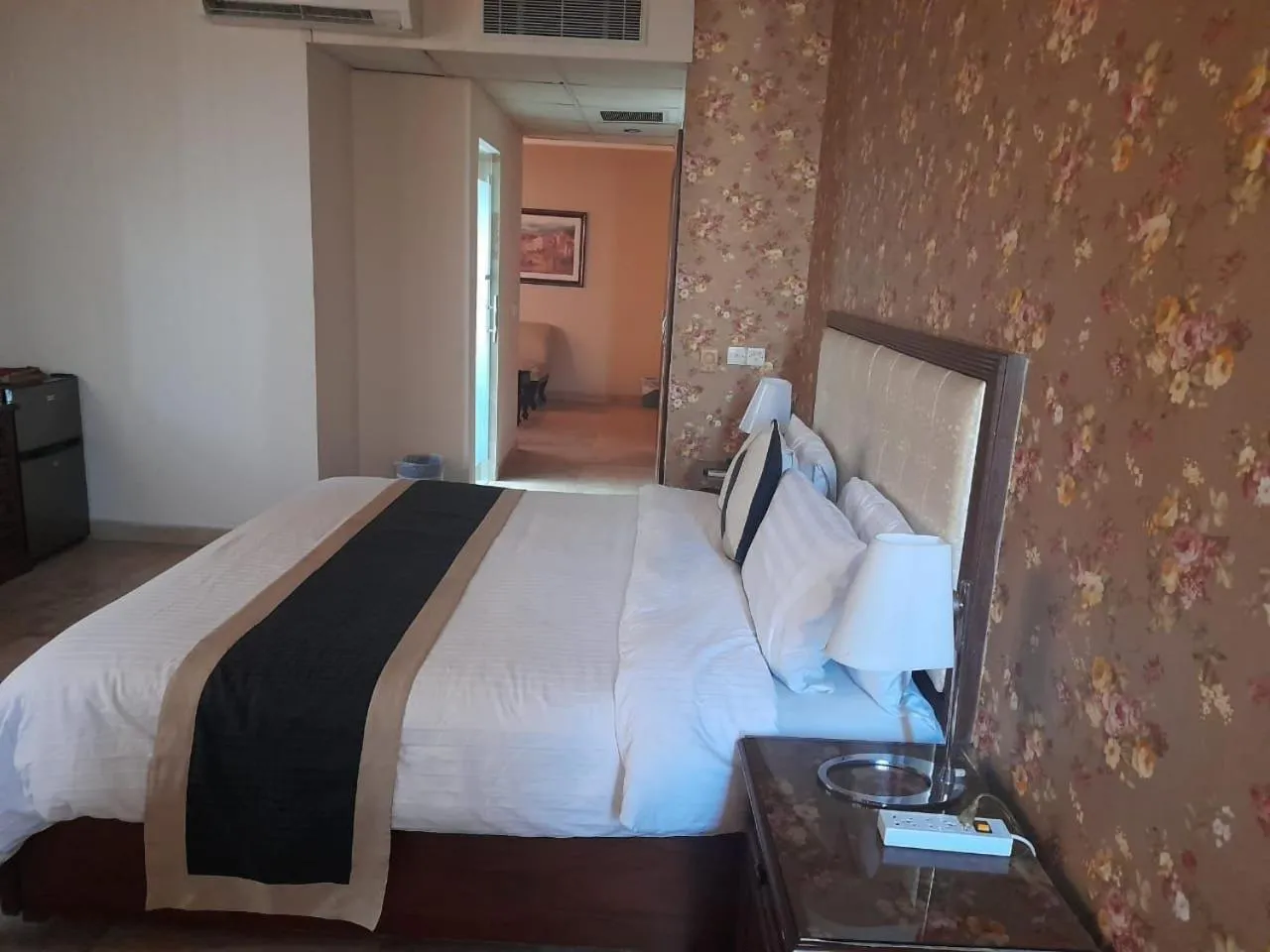 Bed in Shalimar Tower Hotel Lahore