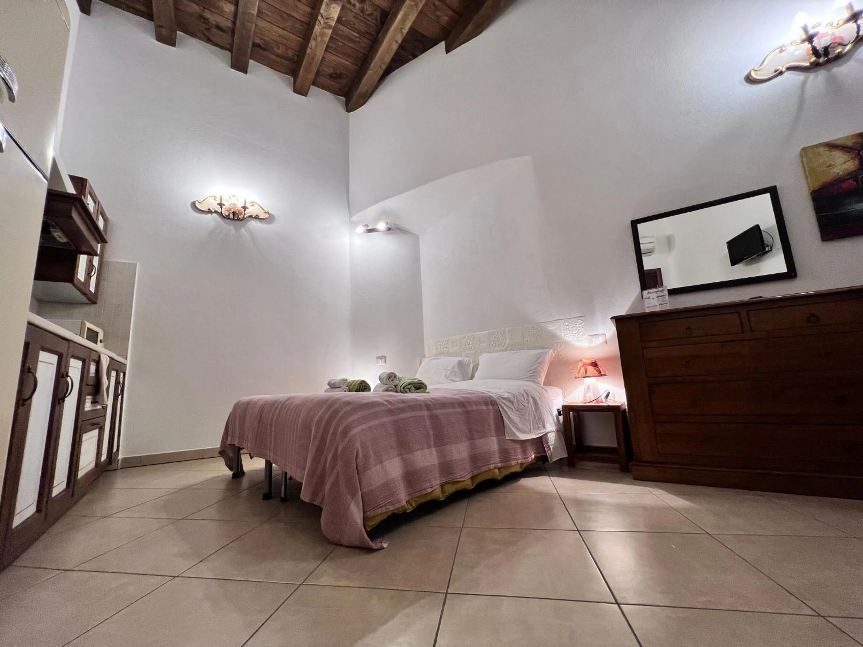 Bed in L'Antica Torre Caralis Holiday