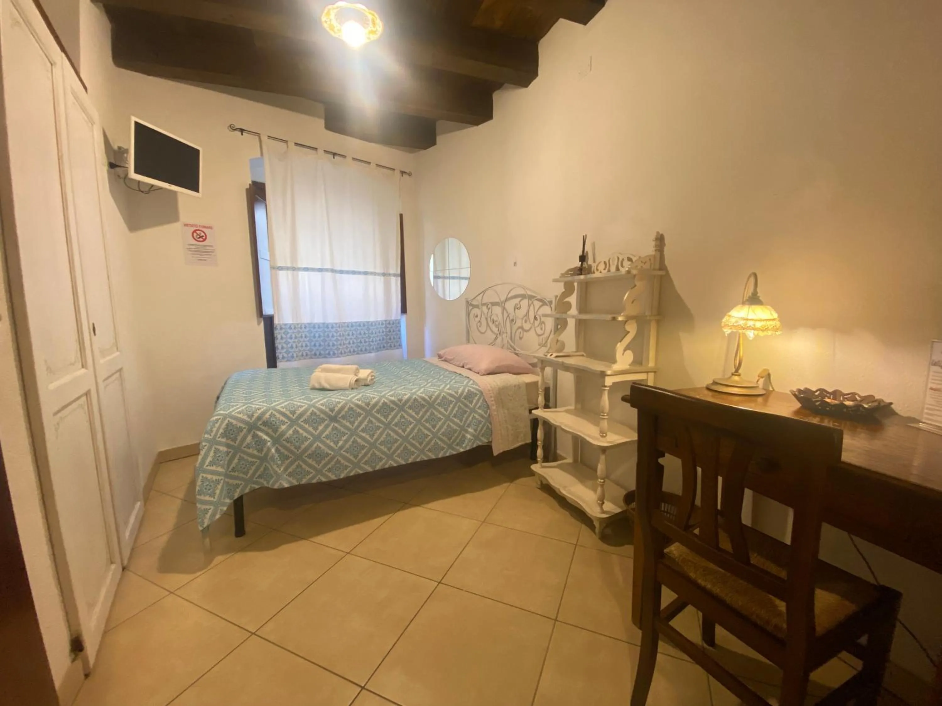 Bed in L'Antica Torre Caralis Holiday