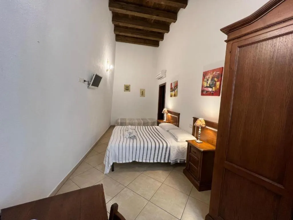 Bed in L'Antica Torre Caralis Holiday