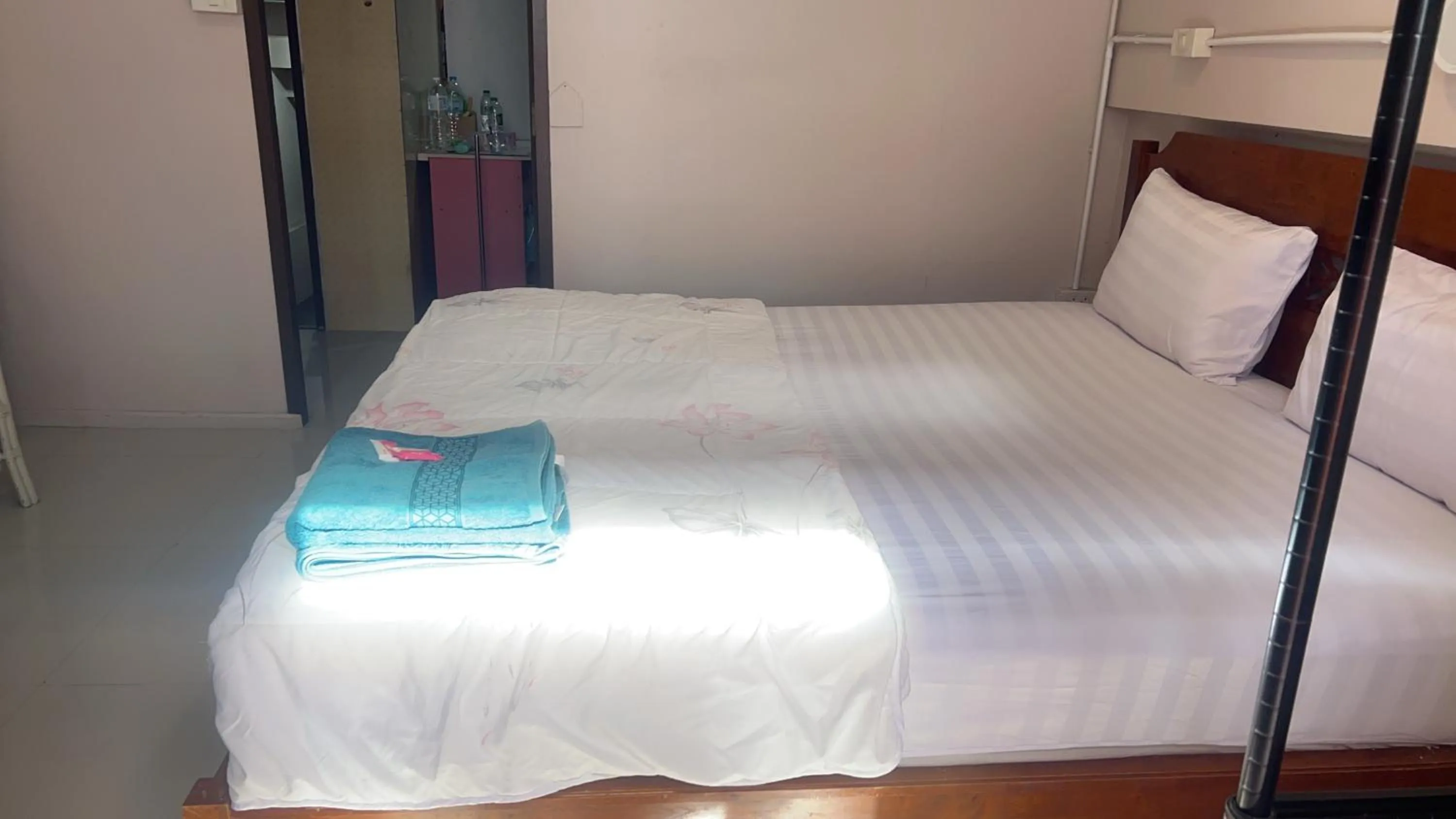 Bed in SMILE HOME GUESTHOUSE