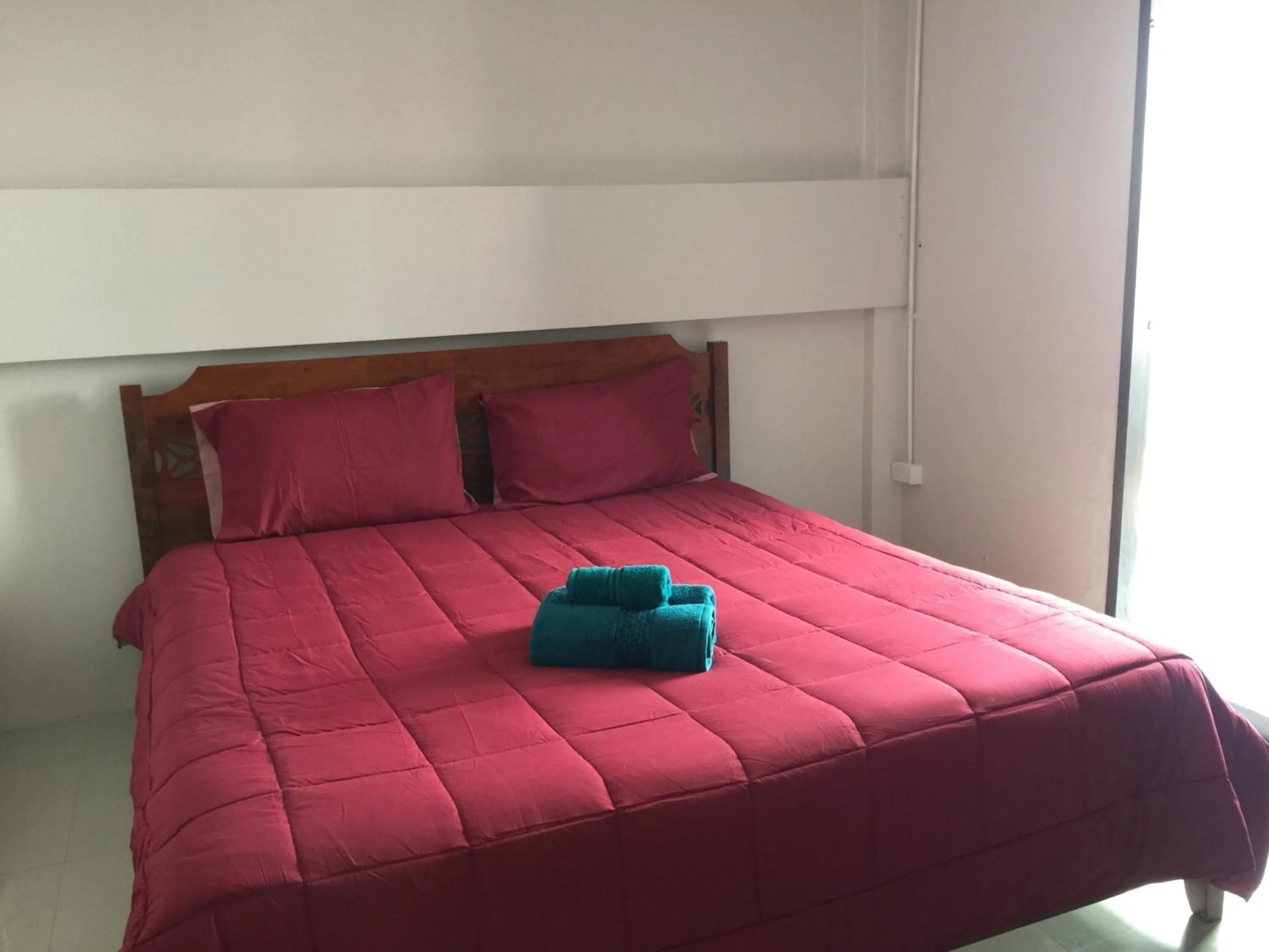 Bed in SMILE HOME GUESTHOUSE