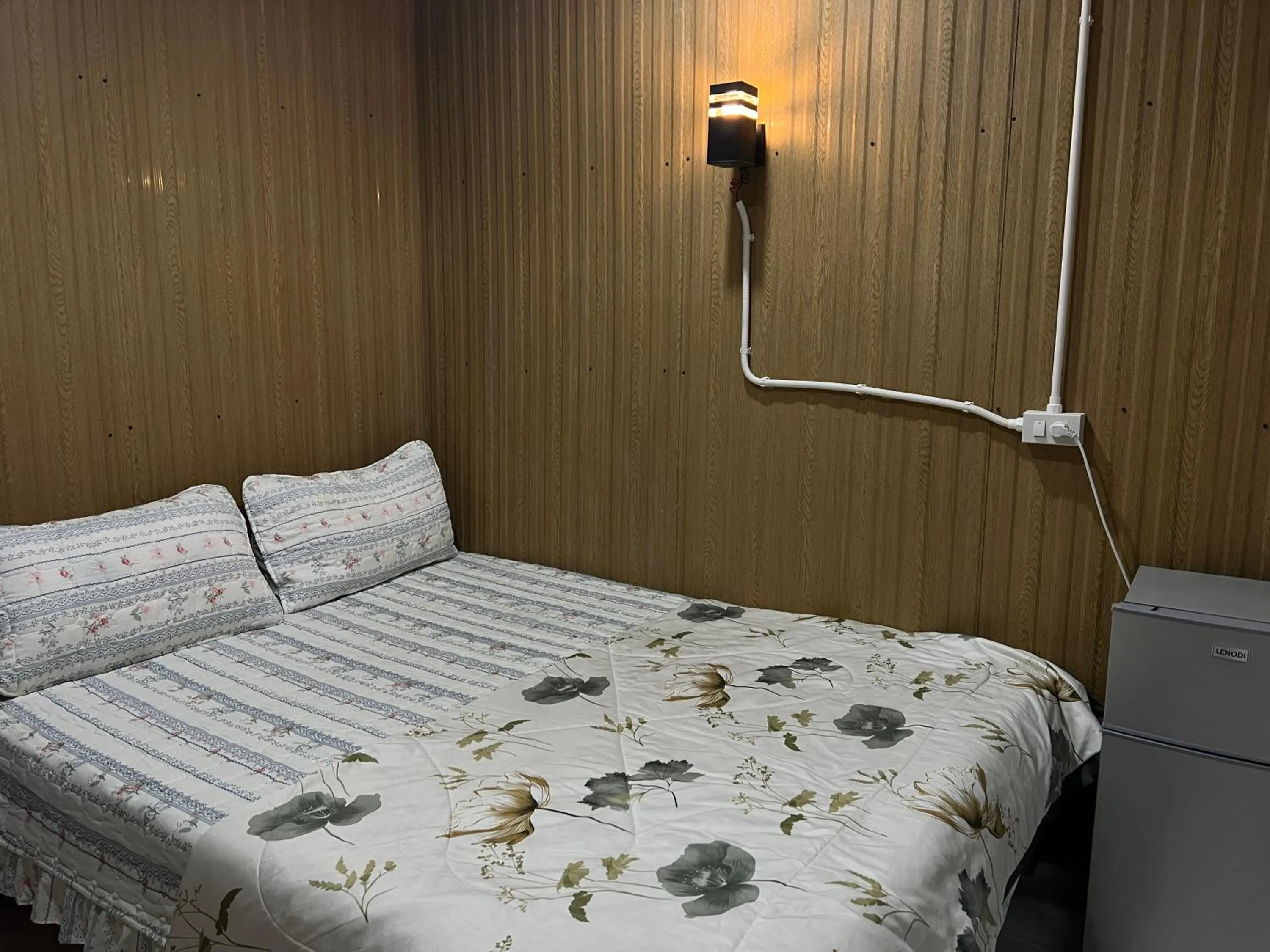 Bed in SMILE HOME GUESTHOUSE