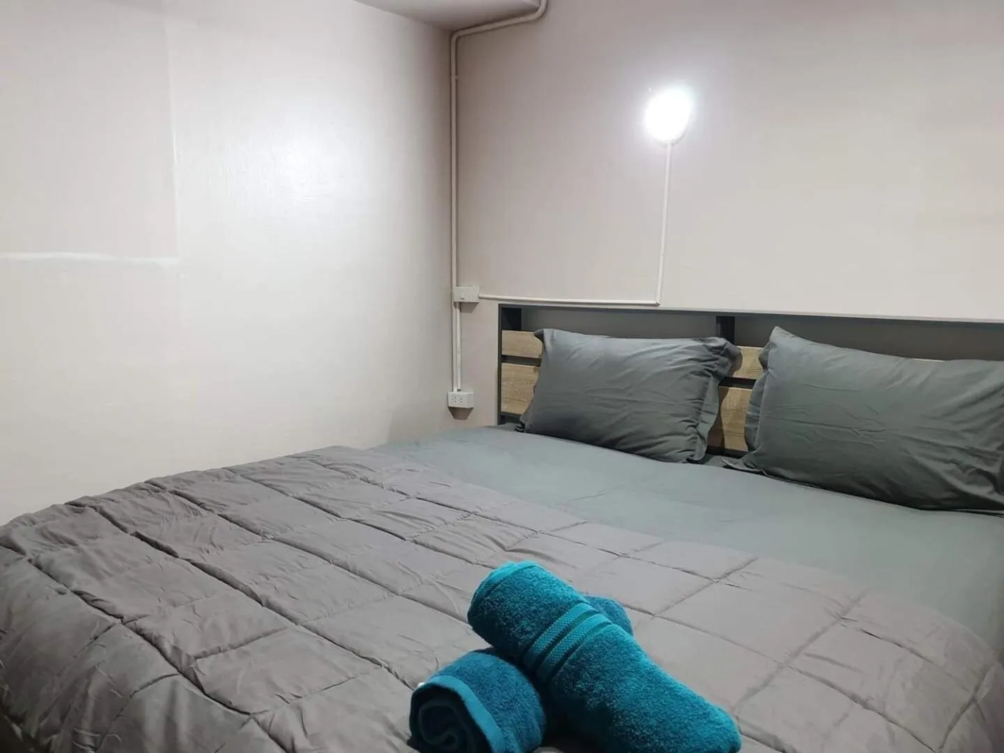 Bed in SMILE HOME GUESTHOUSE