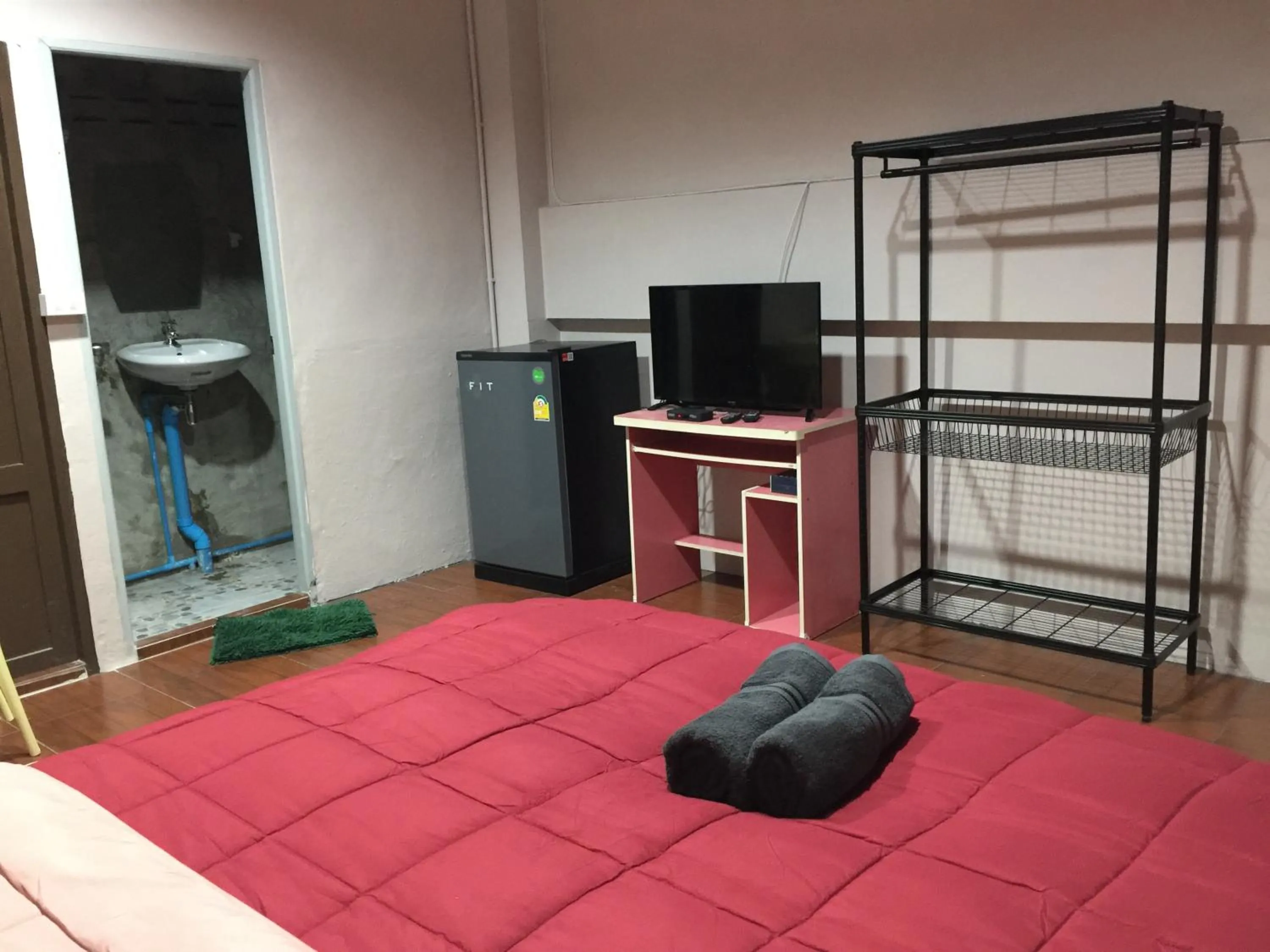 Bed in SMILE HOME GUESTHOUSE