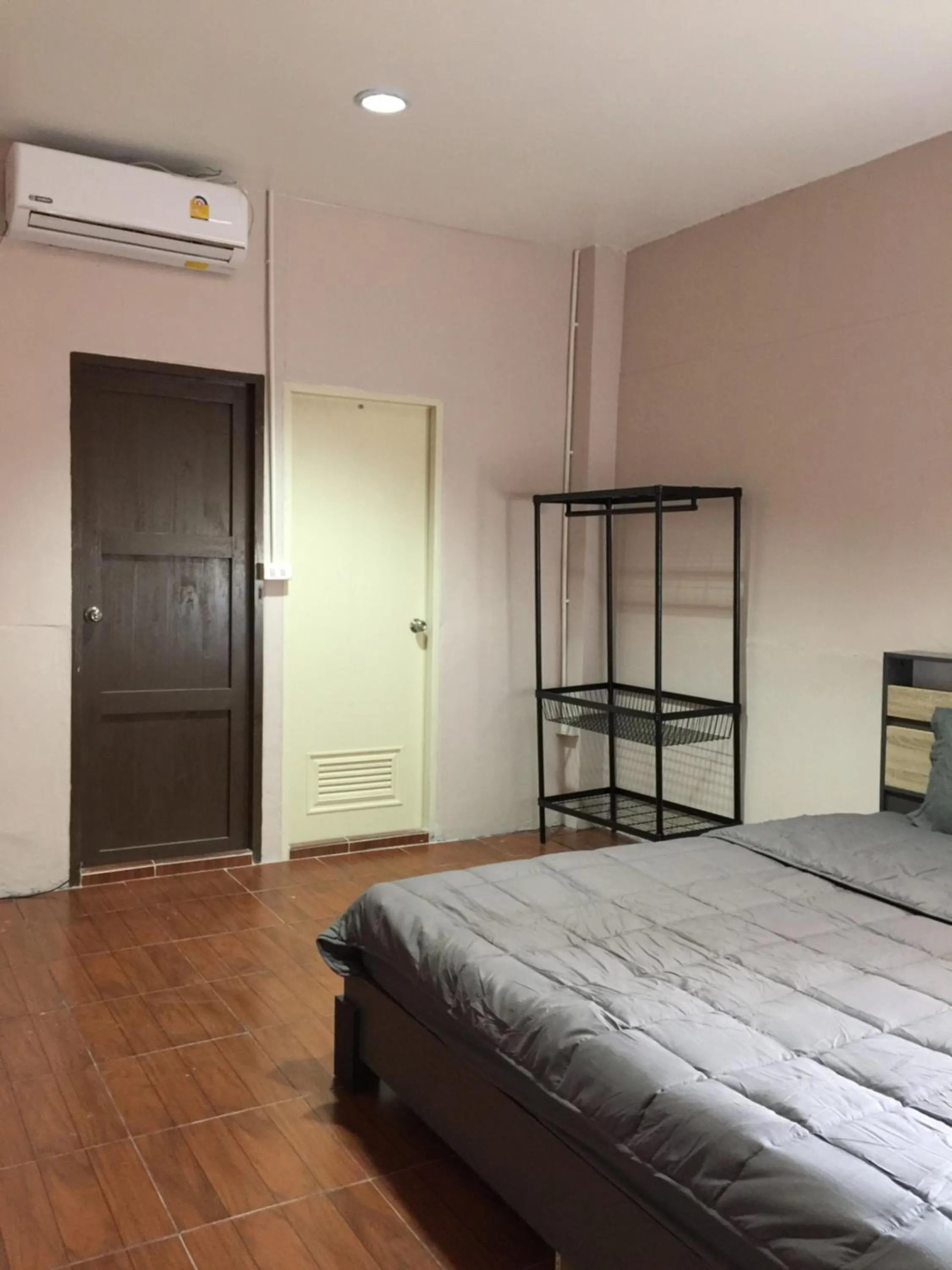 Bed in SMILE HOME GUESTHOUSE