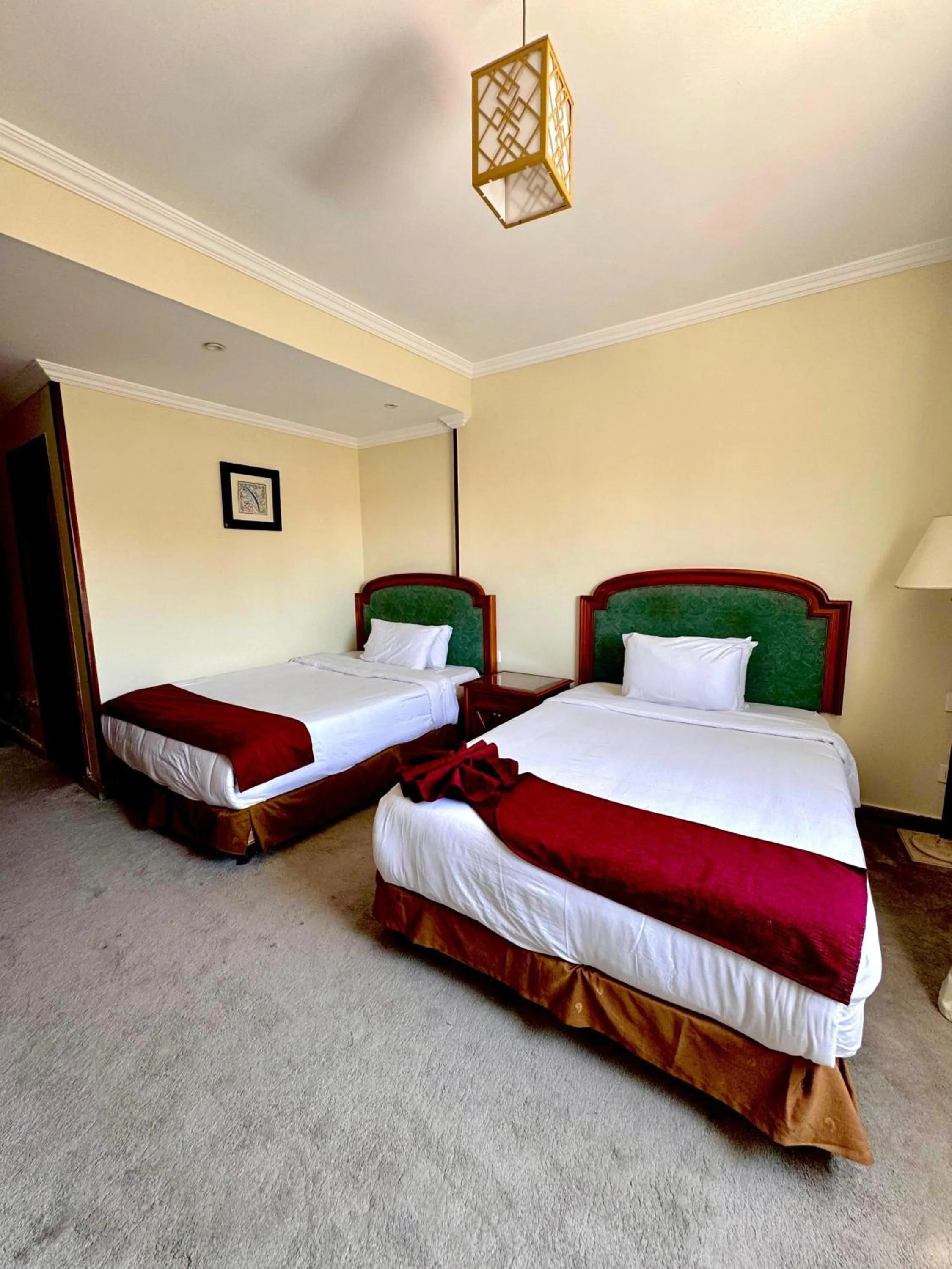 Bed in PYRAMIDS TOWER Inn