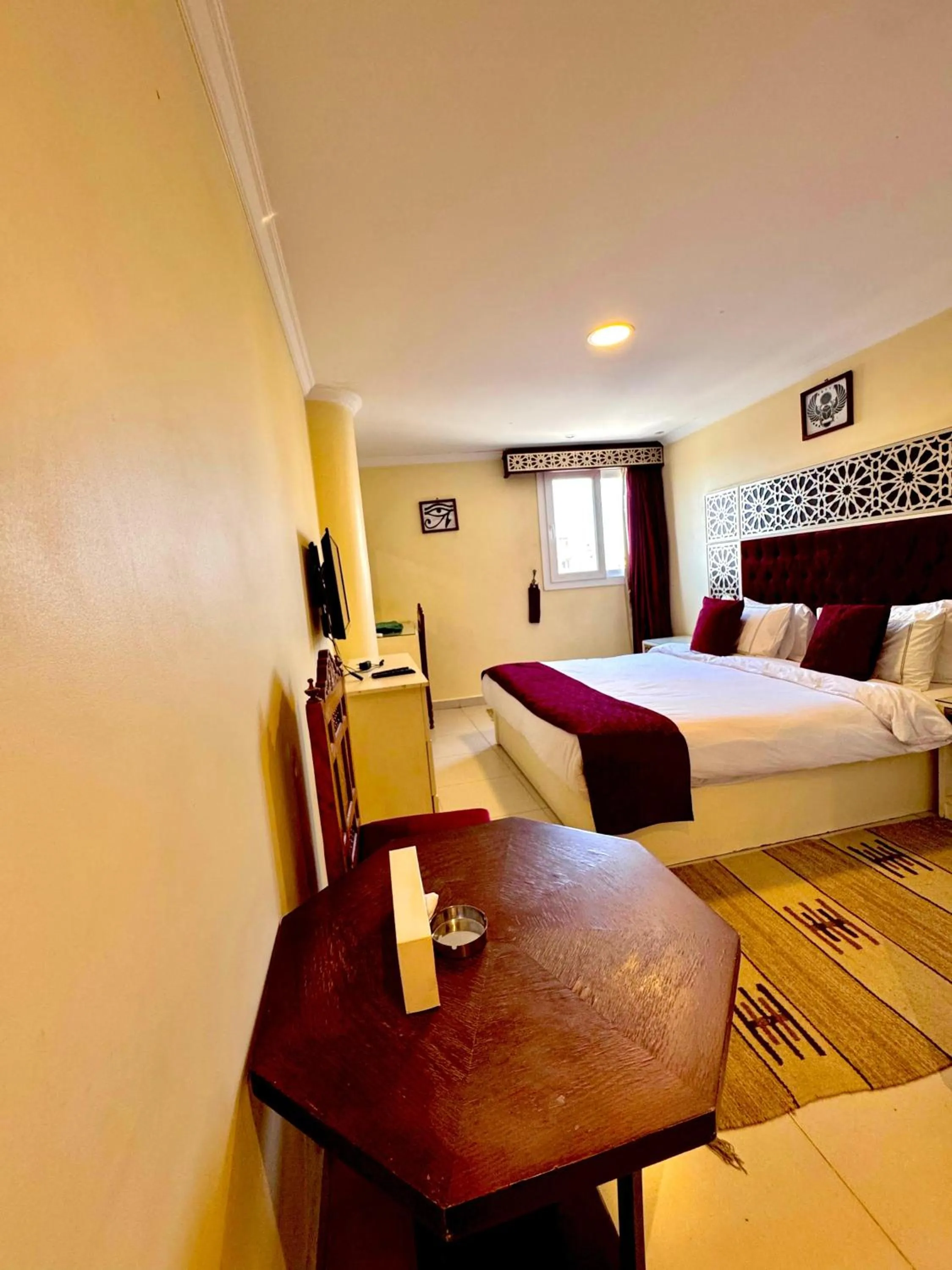 Bed in PYRAMIDS TOWER Inn