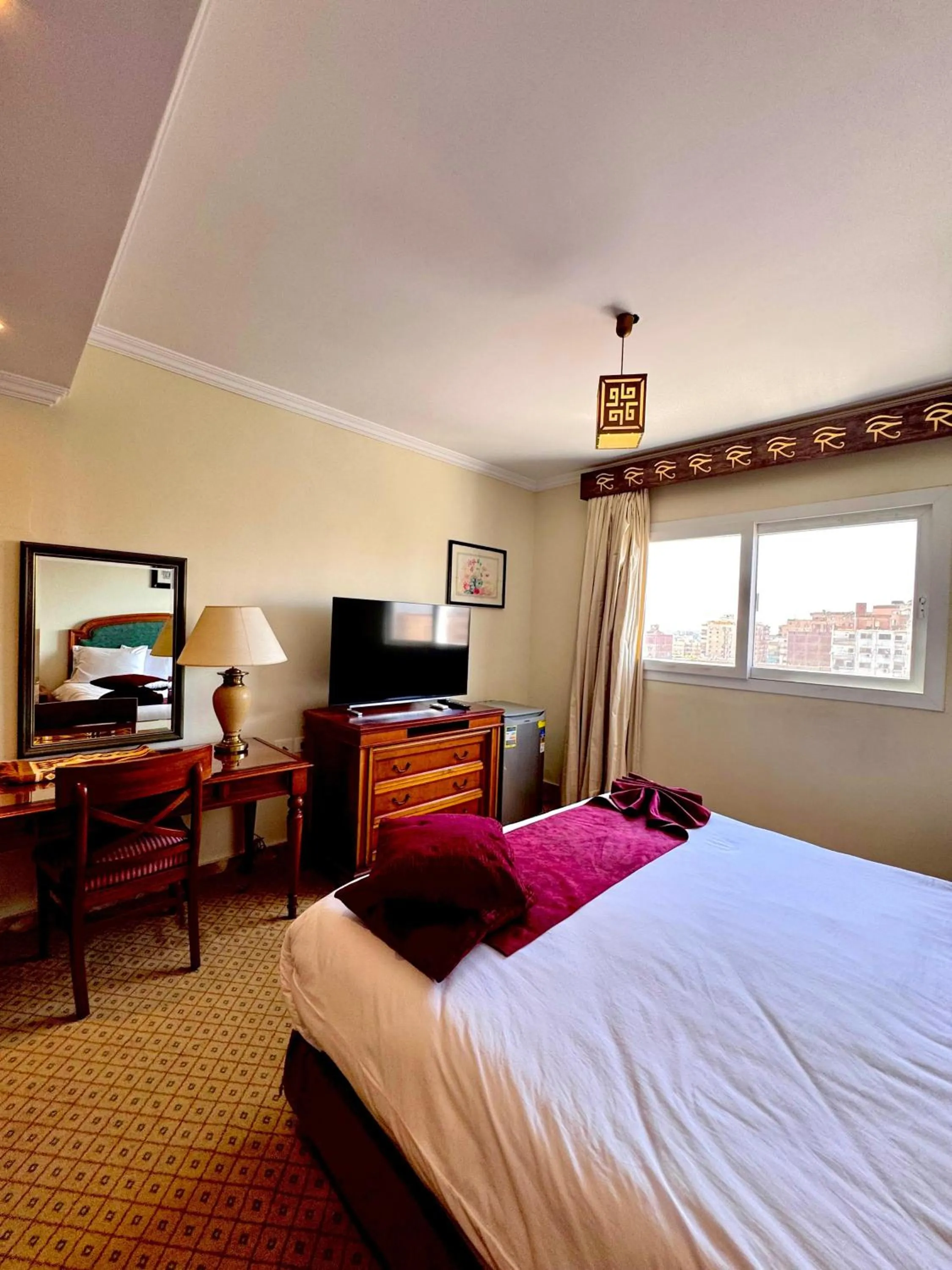 Bed in PYRAMIDS TOWER Inn