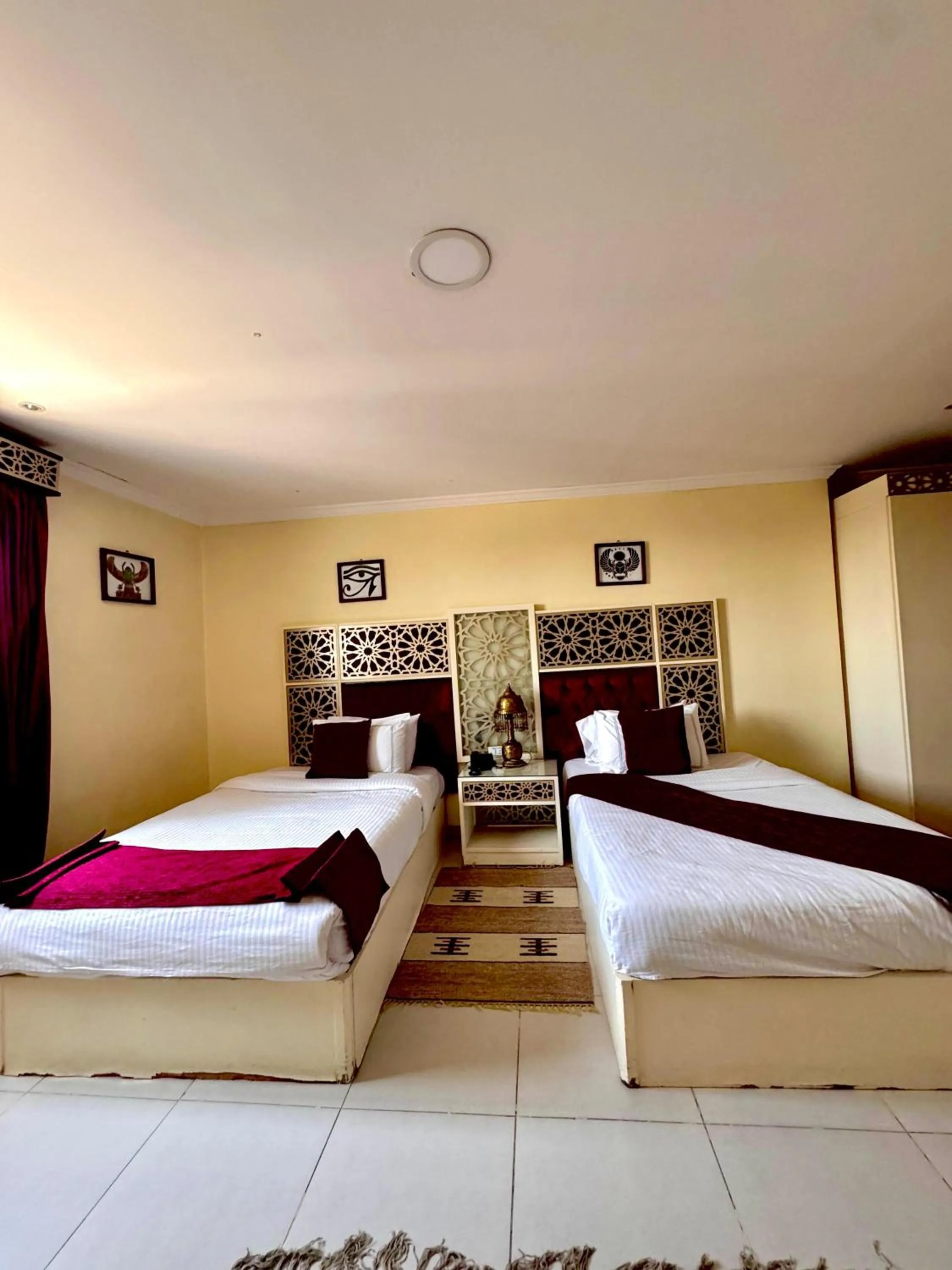 Bed in PYRAMIDS TOWER Inn