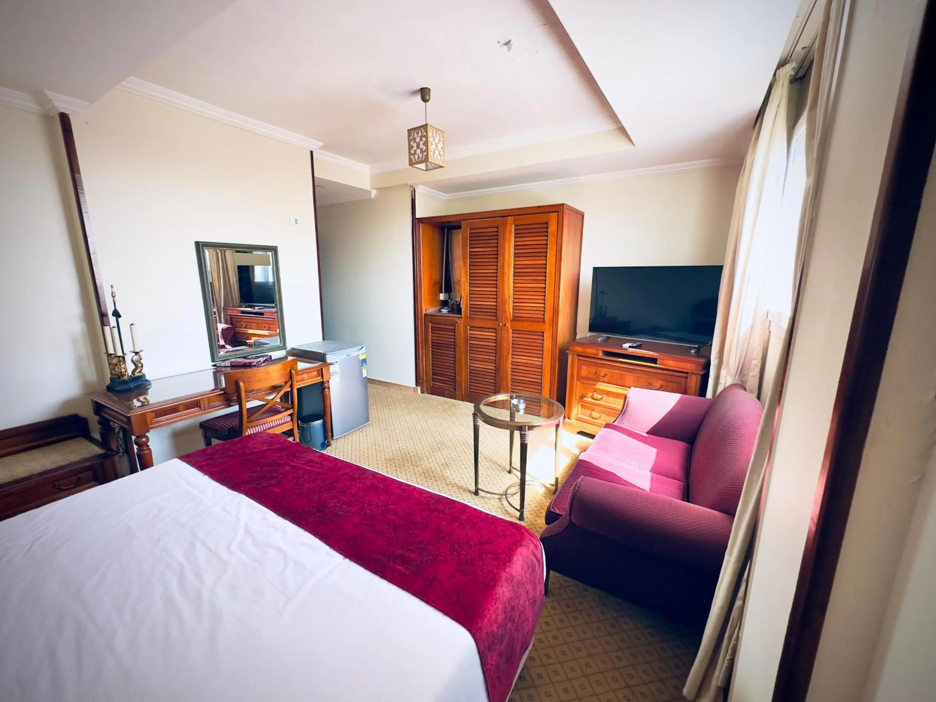 Communal lounge/ TV room, Bed in PYRAMIDS TOWER Inn