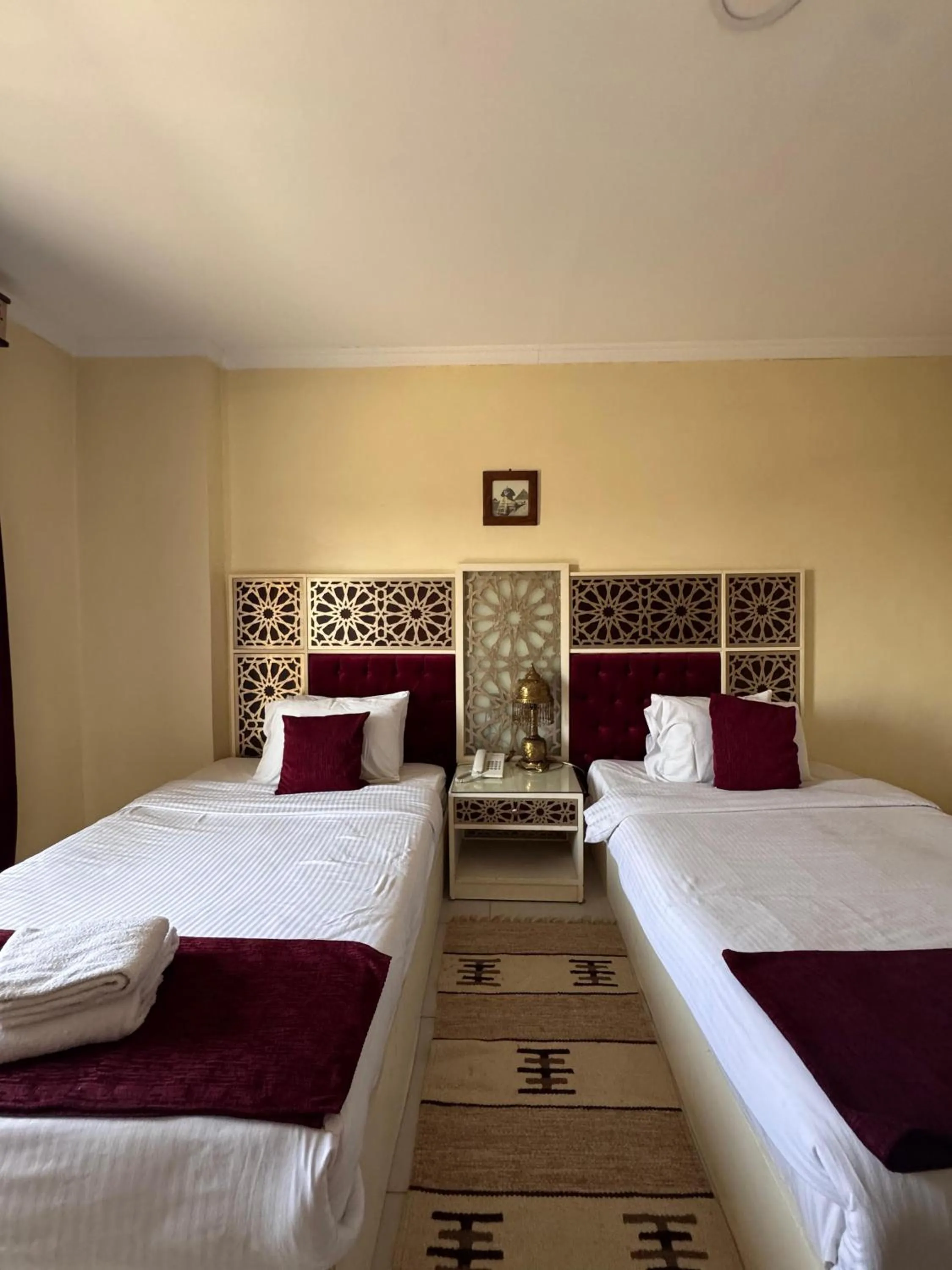 Bed in PYRAMIDS TOWER Inn