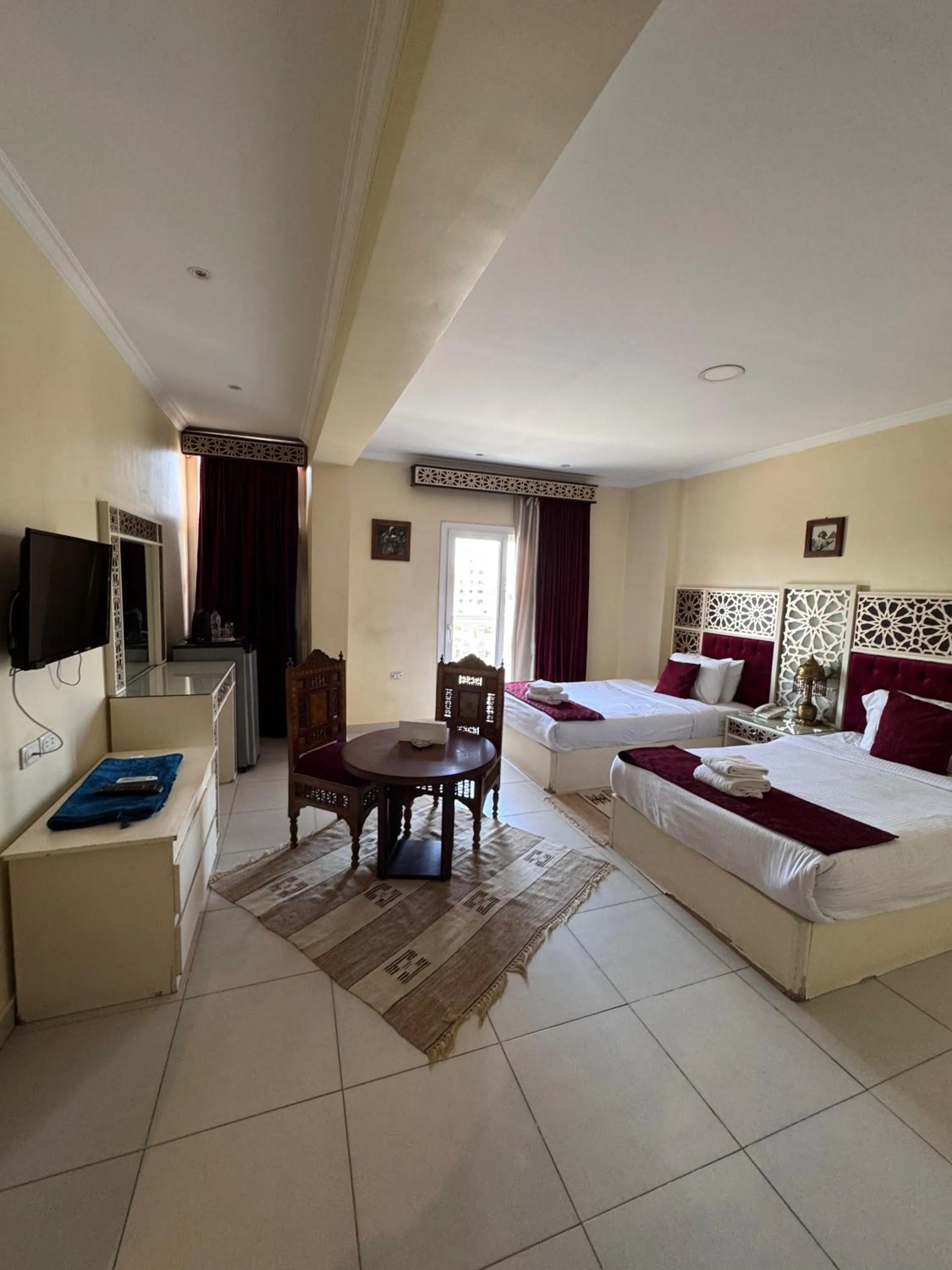 Bed in PYRAMIDS TOWER Inn