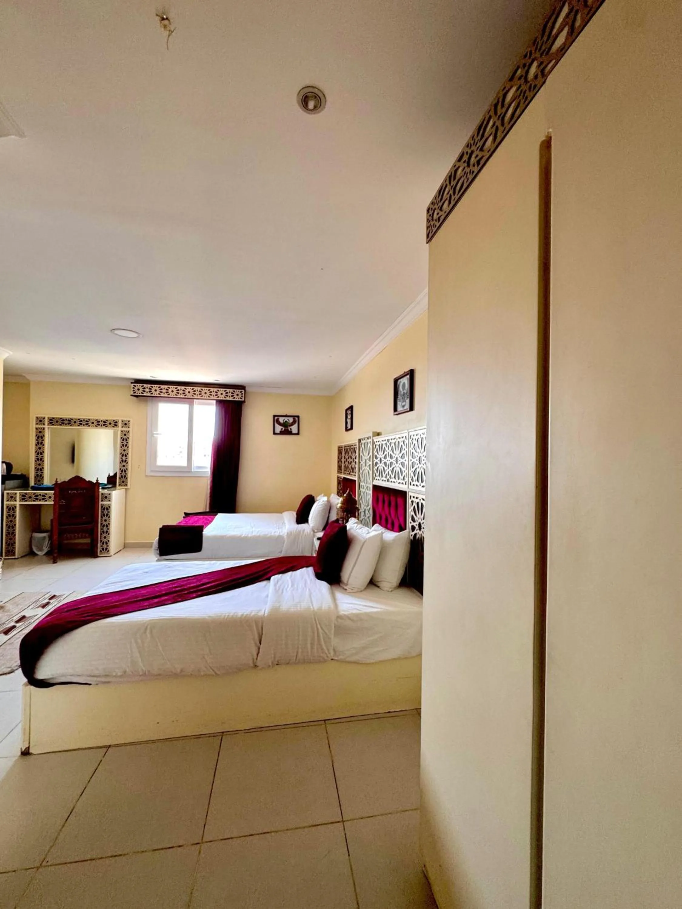 Bed in PYRAMIDS TOWER Inn