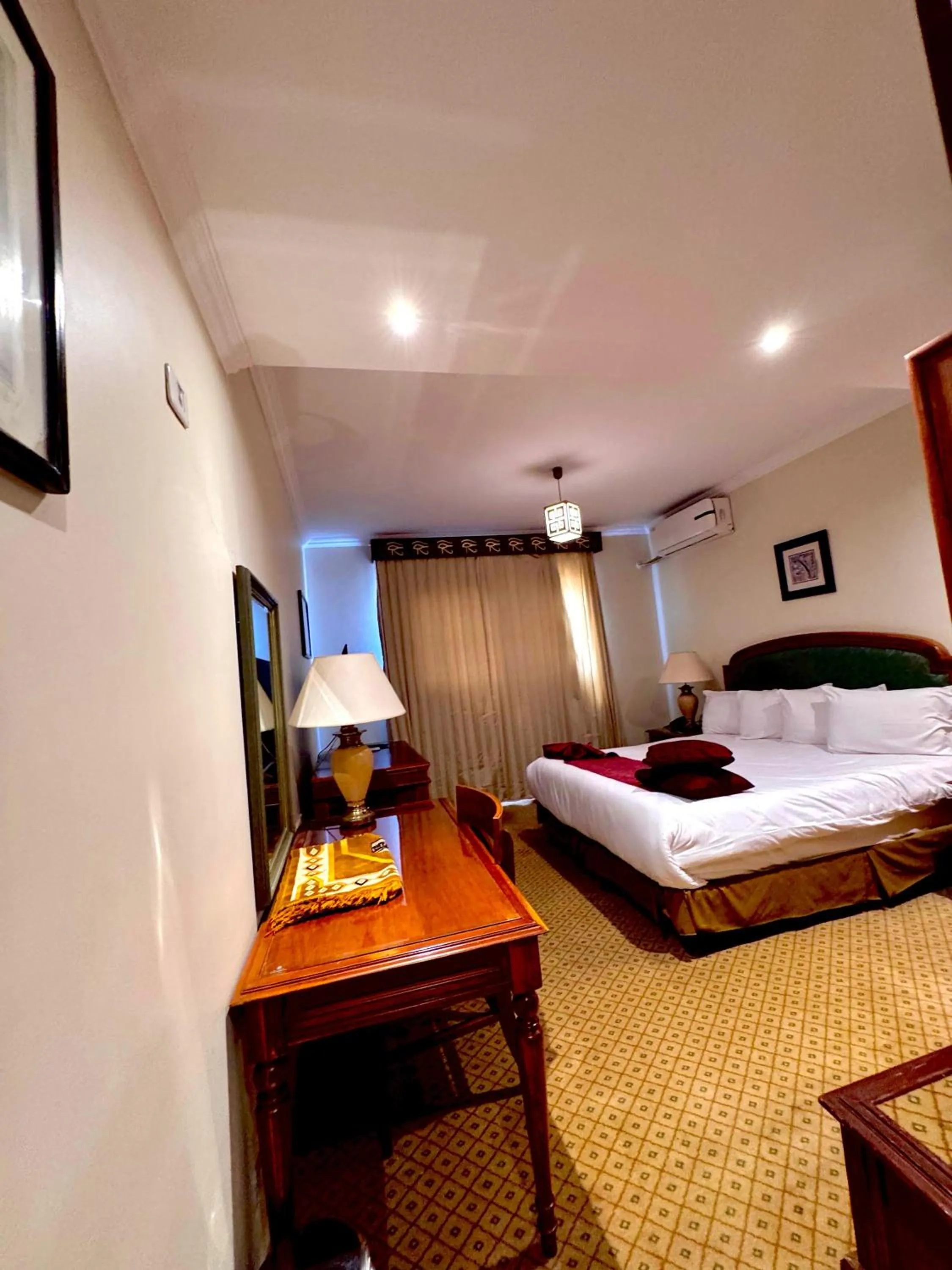 Bed in PYRAMIDS TOWER Inn