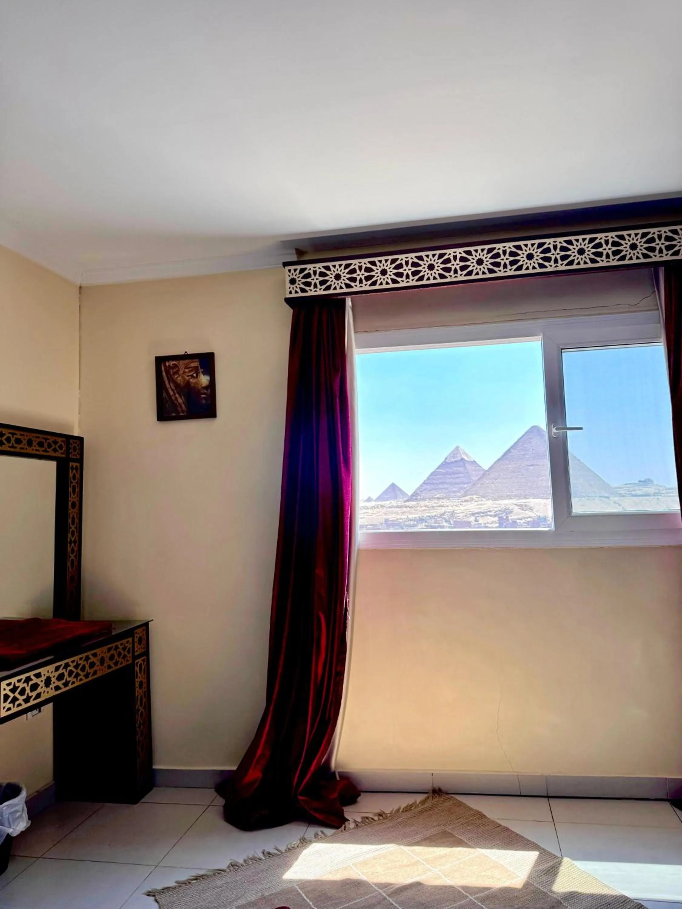 Bed in PYRAMIDS TOWER Inn