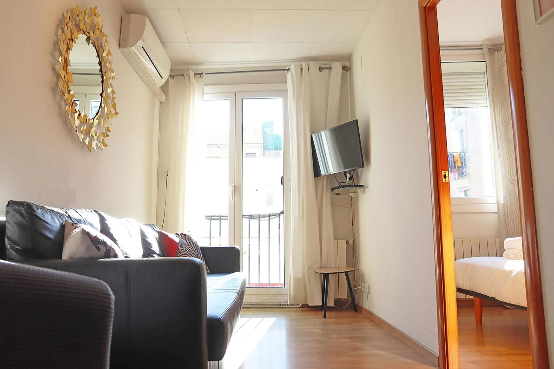 Living room, Bed in Bcn-rentals apartments in the Old town