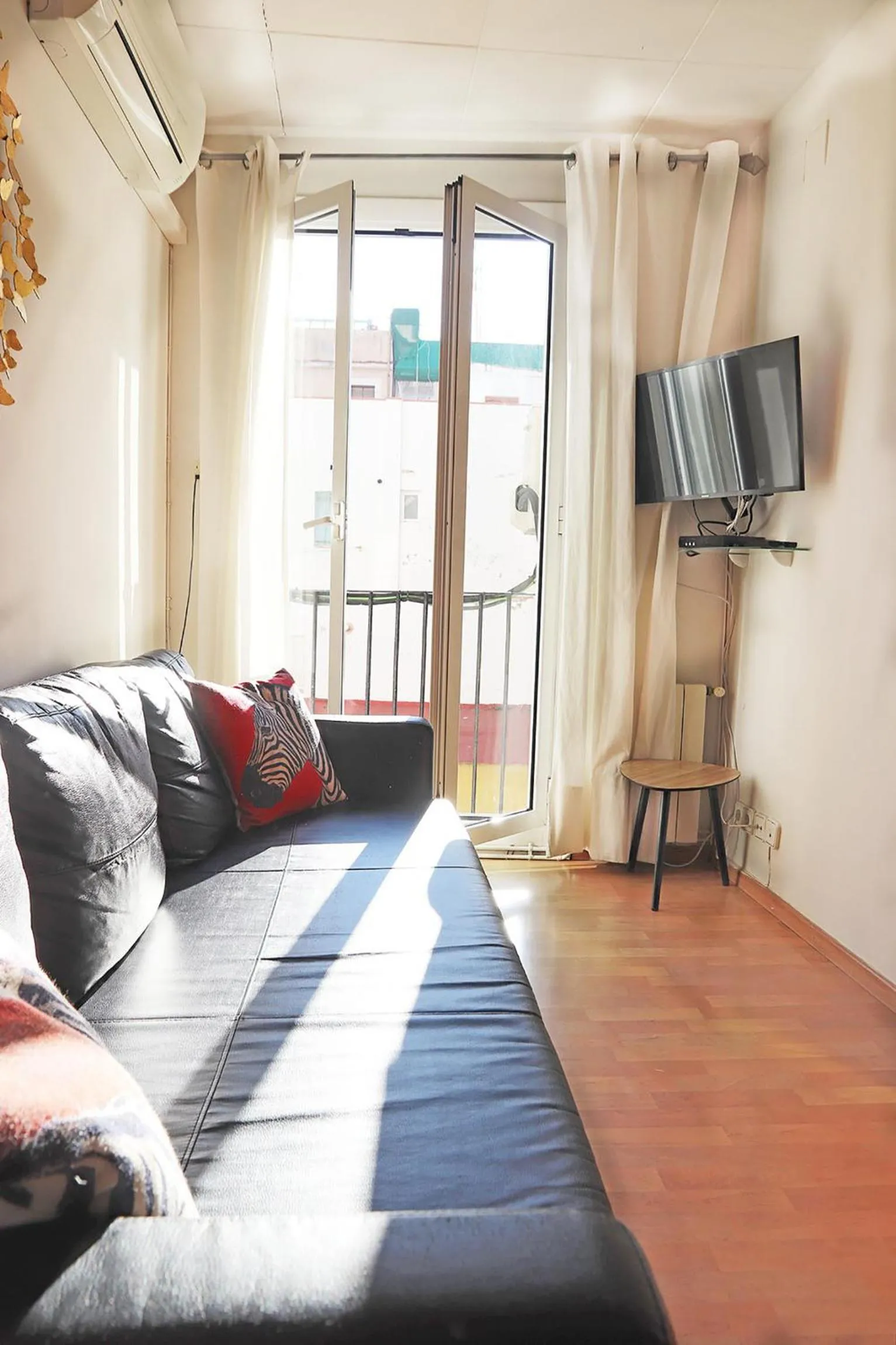 Living room, Bed in Bcn-rentals apartments in the Old town