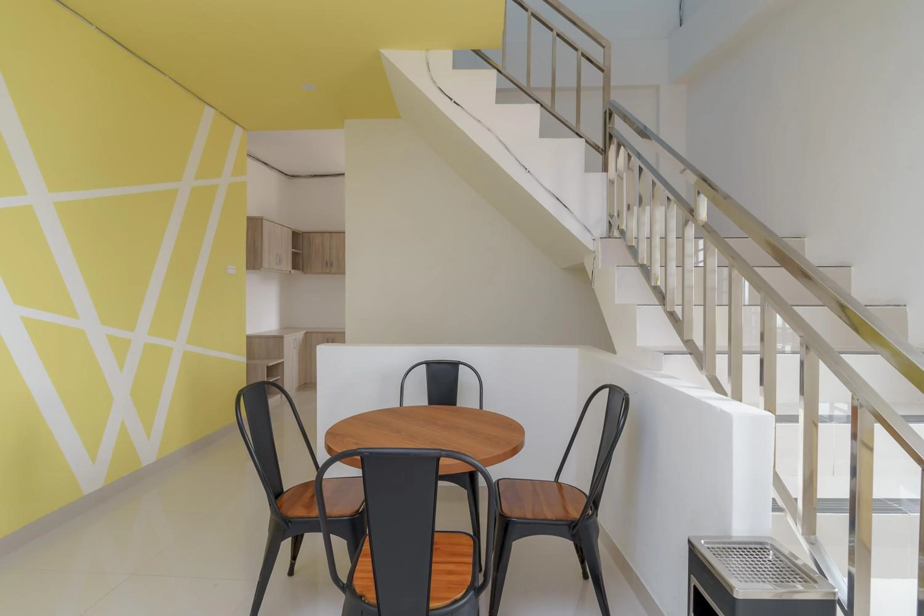 Seating area in RedDoorz Plus at Grand Tara Homestay Palembang