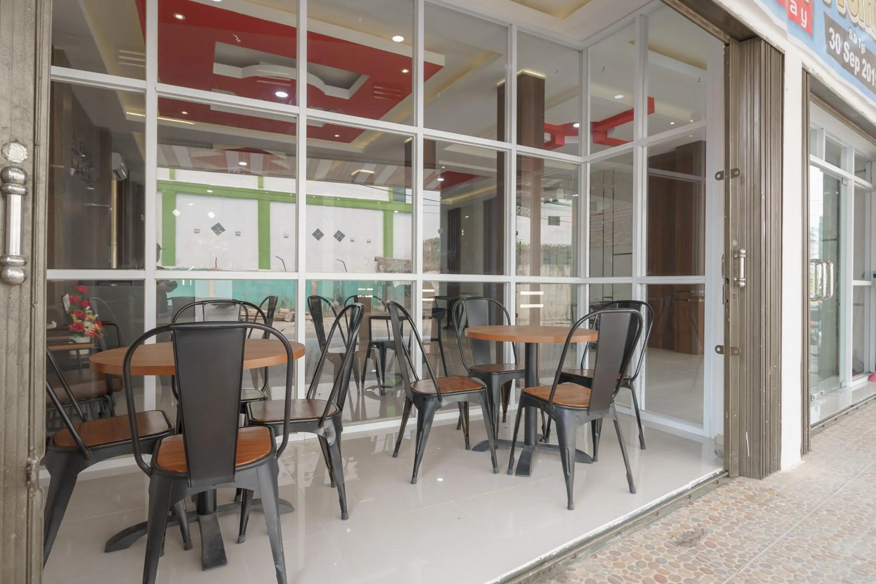 Seating area in RedDoorz Plus at Grand Tara Homestay Palembang