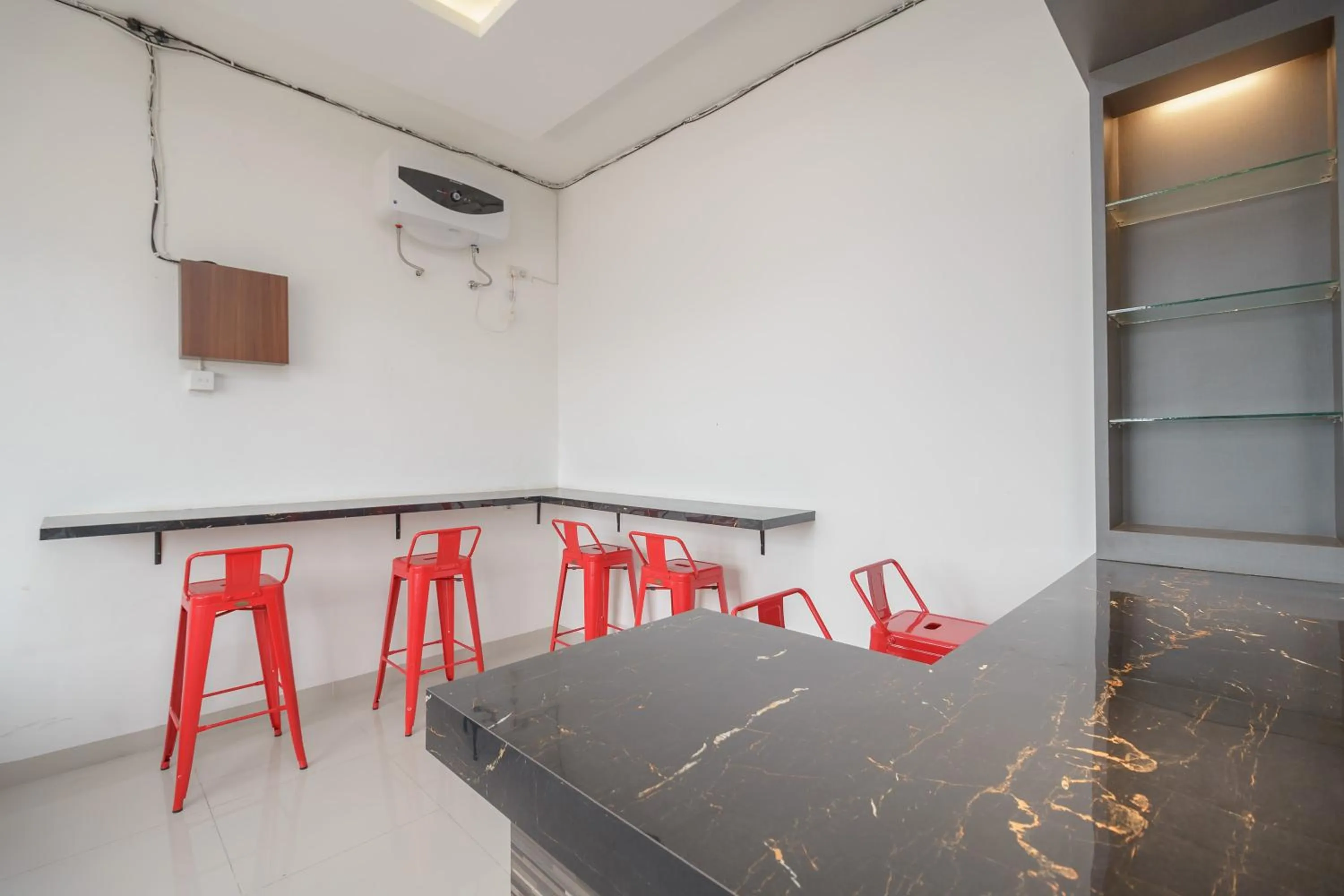 Seating area in RedDoorz Plus at Grand Tara Homestay Palembang