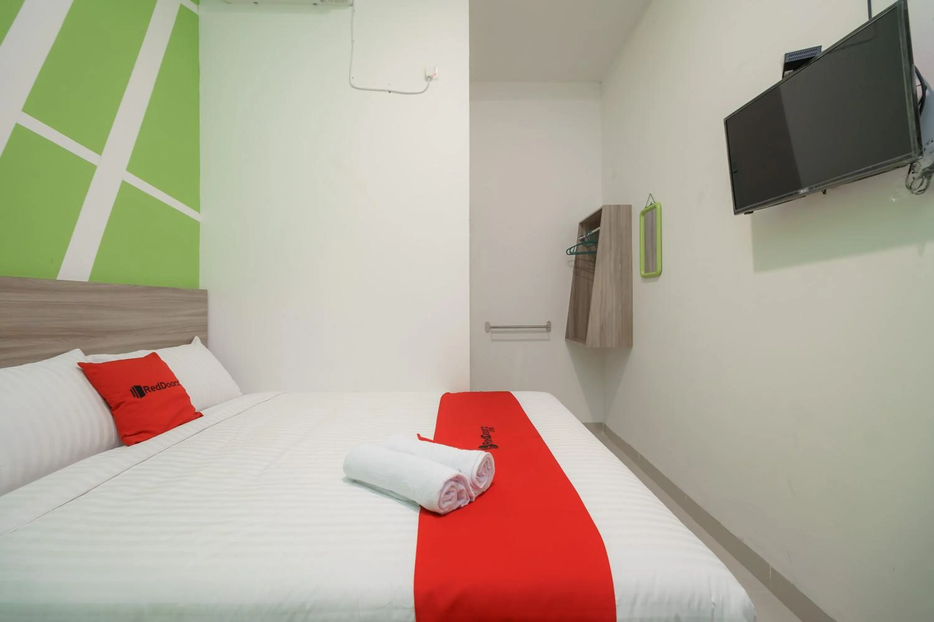 Bedroom, Bed in RedDoorz Plus at Grand Tara Homestay Palembang