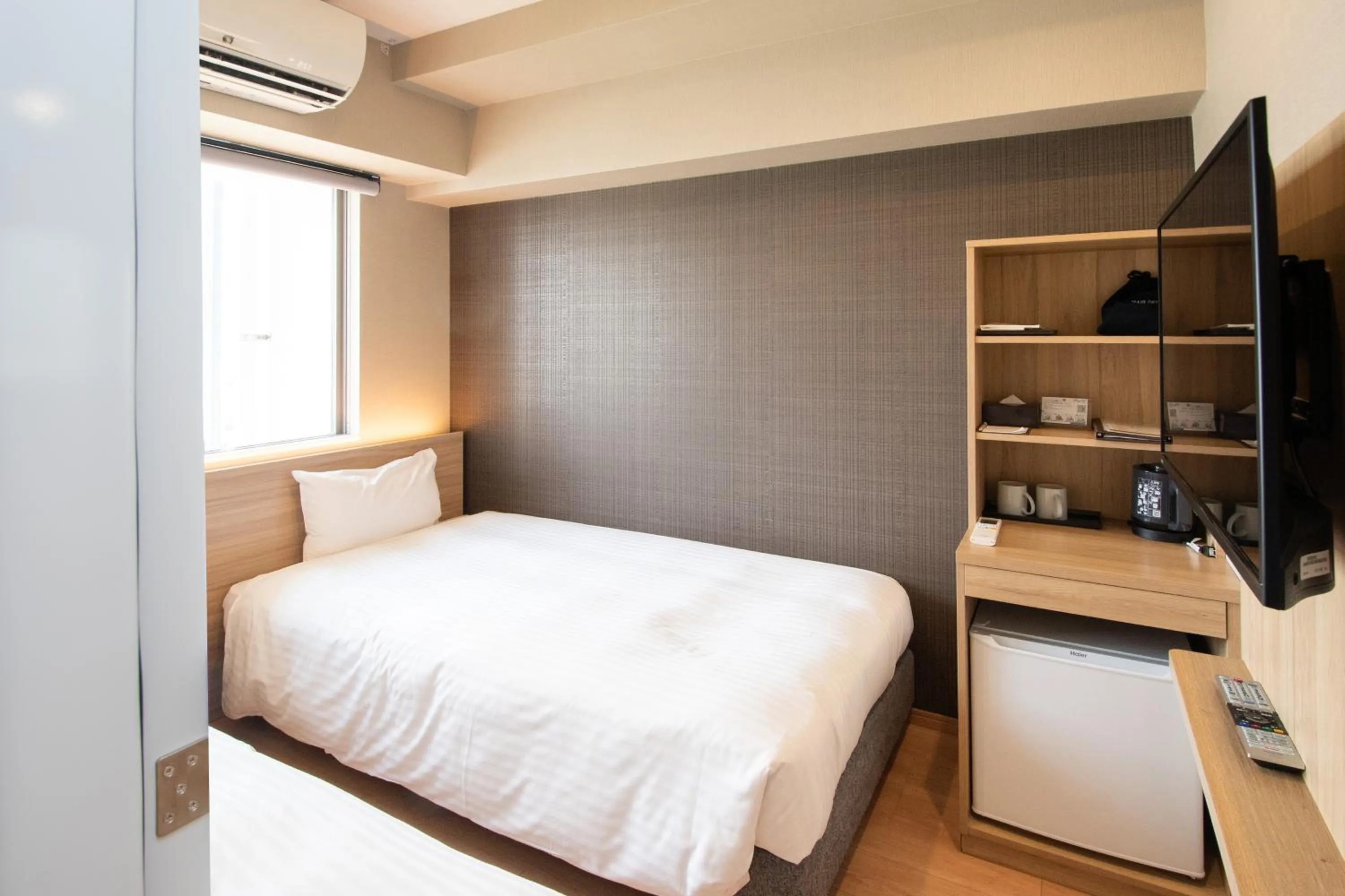 Bedroom, Bed in HOTEL SANSUI NAHA Ryukyu Onsen Naminoue-No-Yu