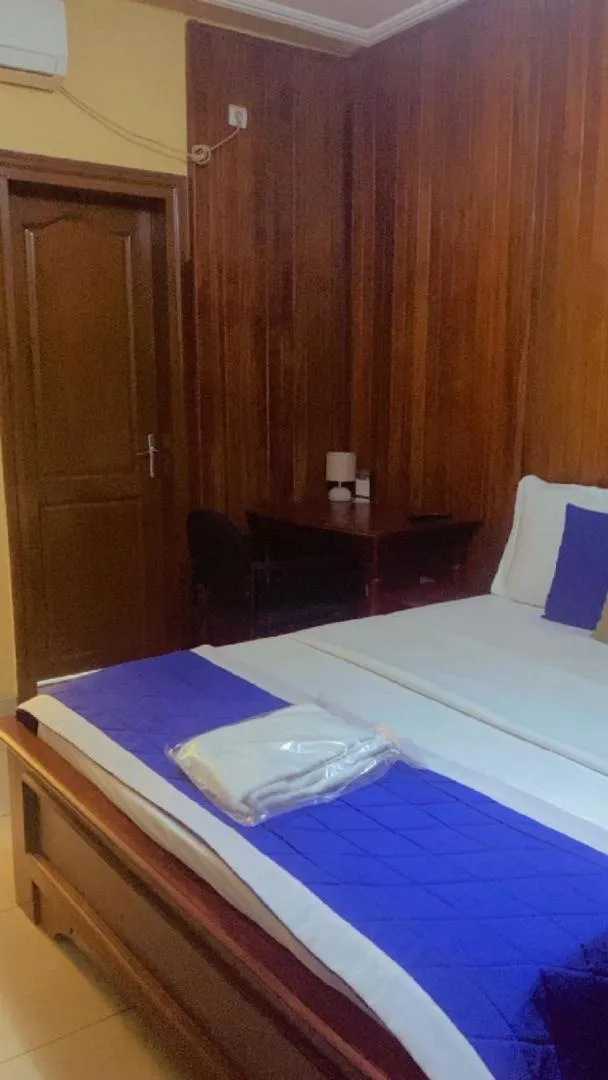 Seating area, Bed in Résidences hôtelières Micheline et Emile BASTOS