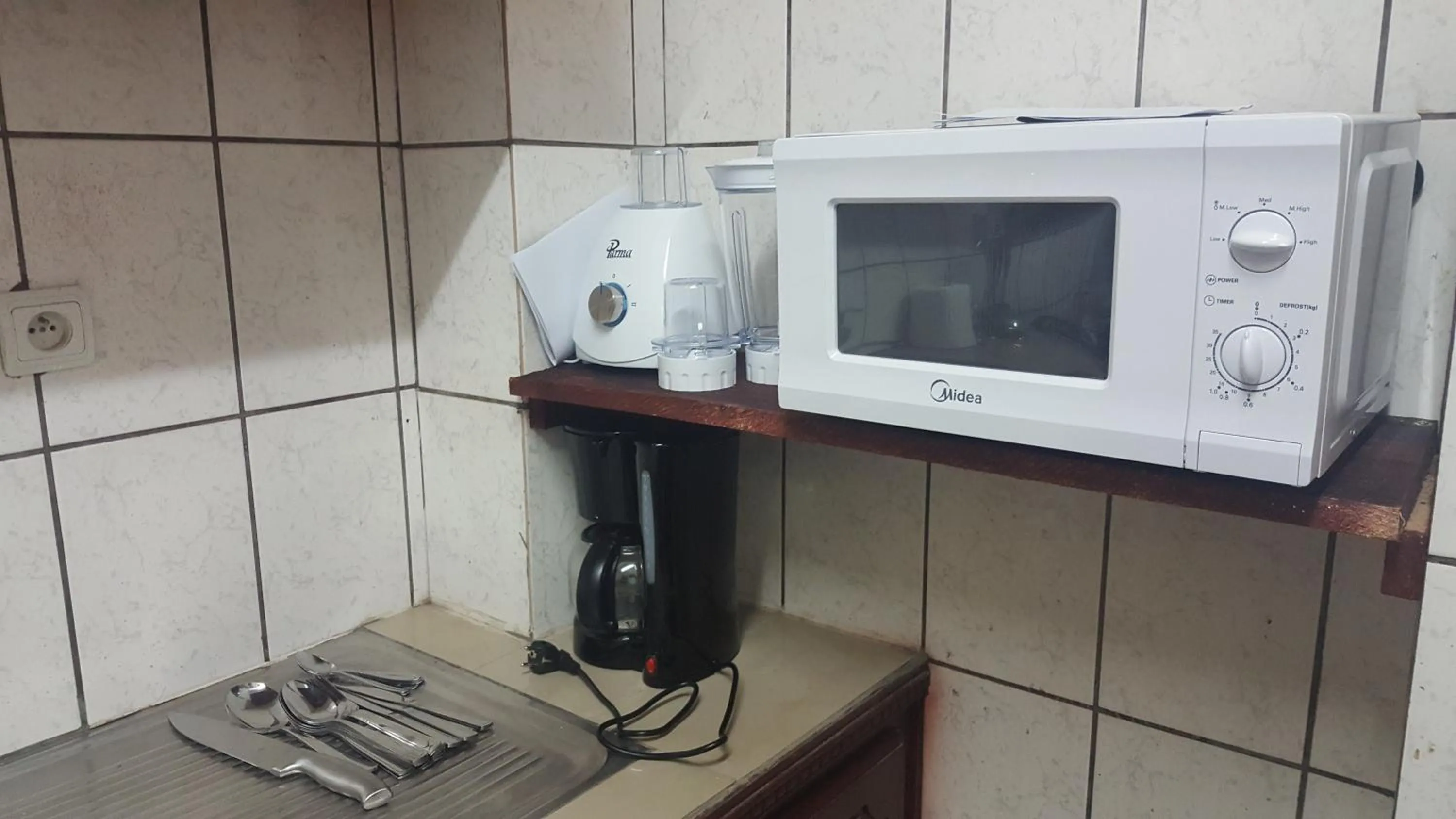 Kitchen or kitchenette in Résidences hôtelières Micheline et Emile BASTOS