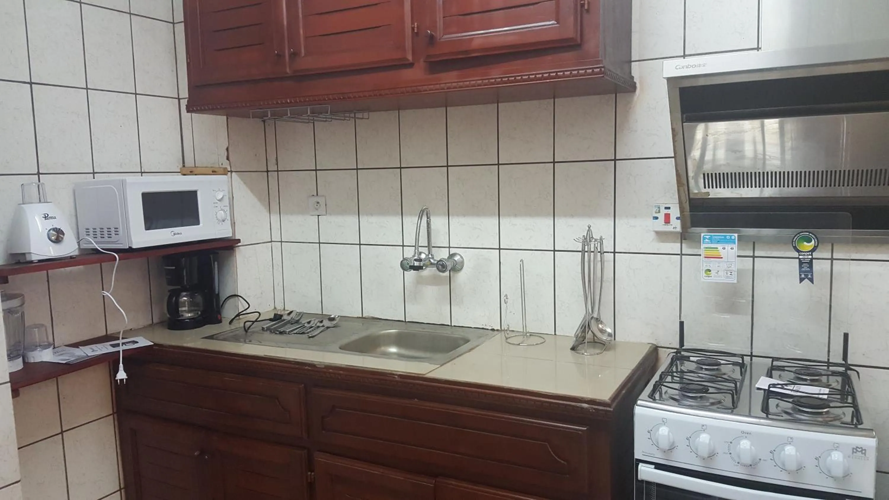 Kitchen or kitchenette in Résidences hôtelières Micheline et Emile BASTOS