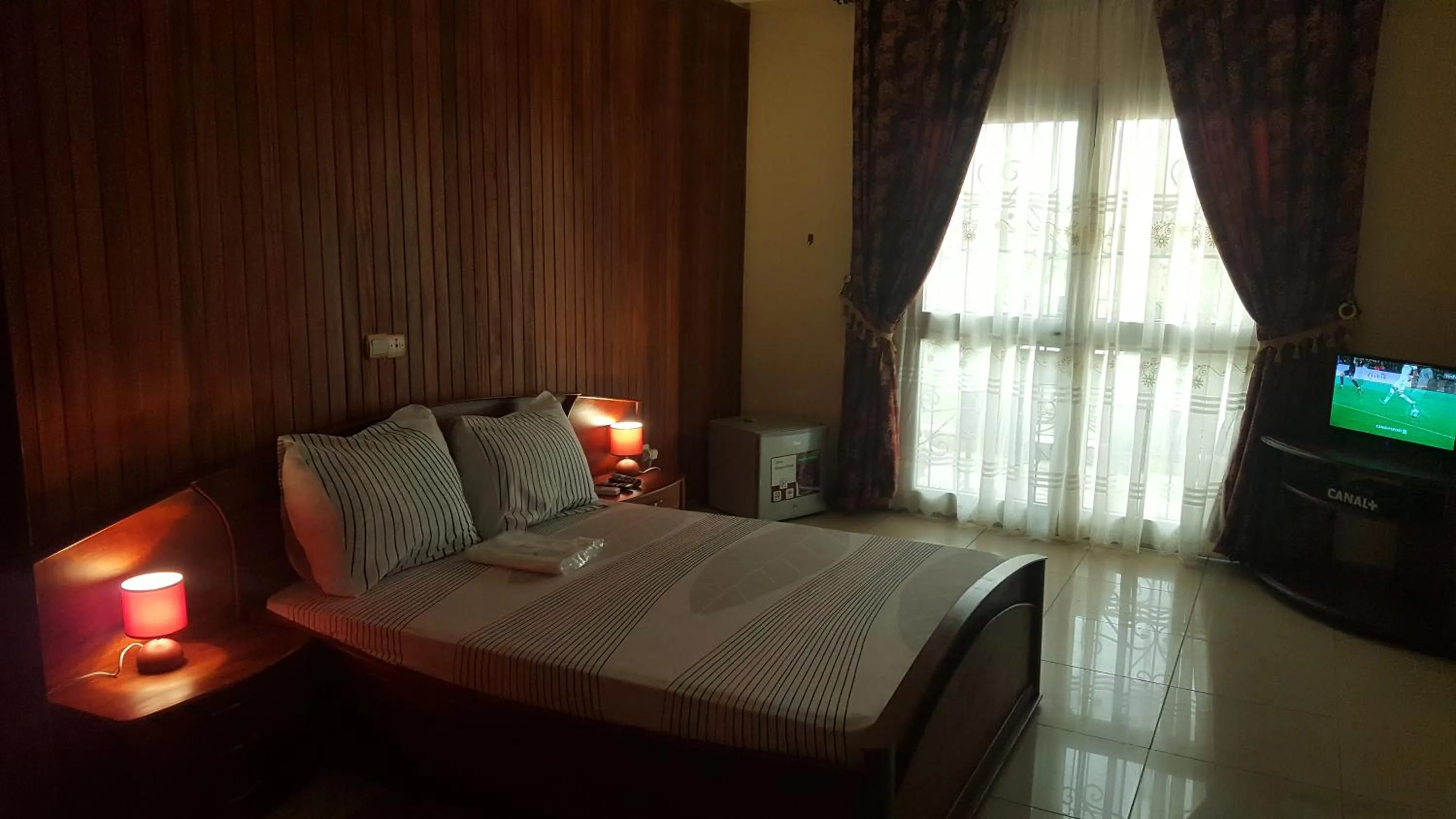 Bed in Résidences hôtelières Micheline et Emile BASTOS