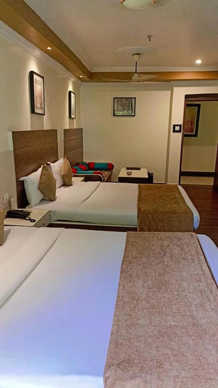 Bed in Hotel Pushpak