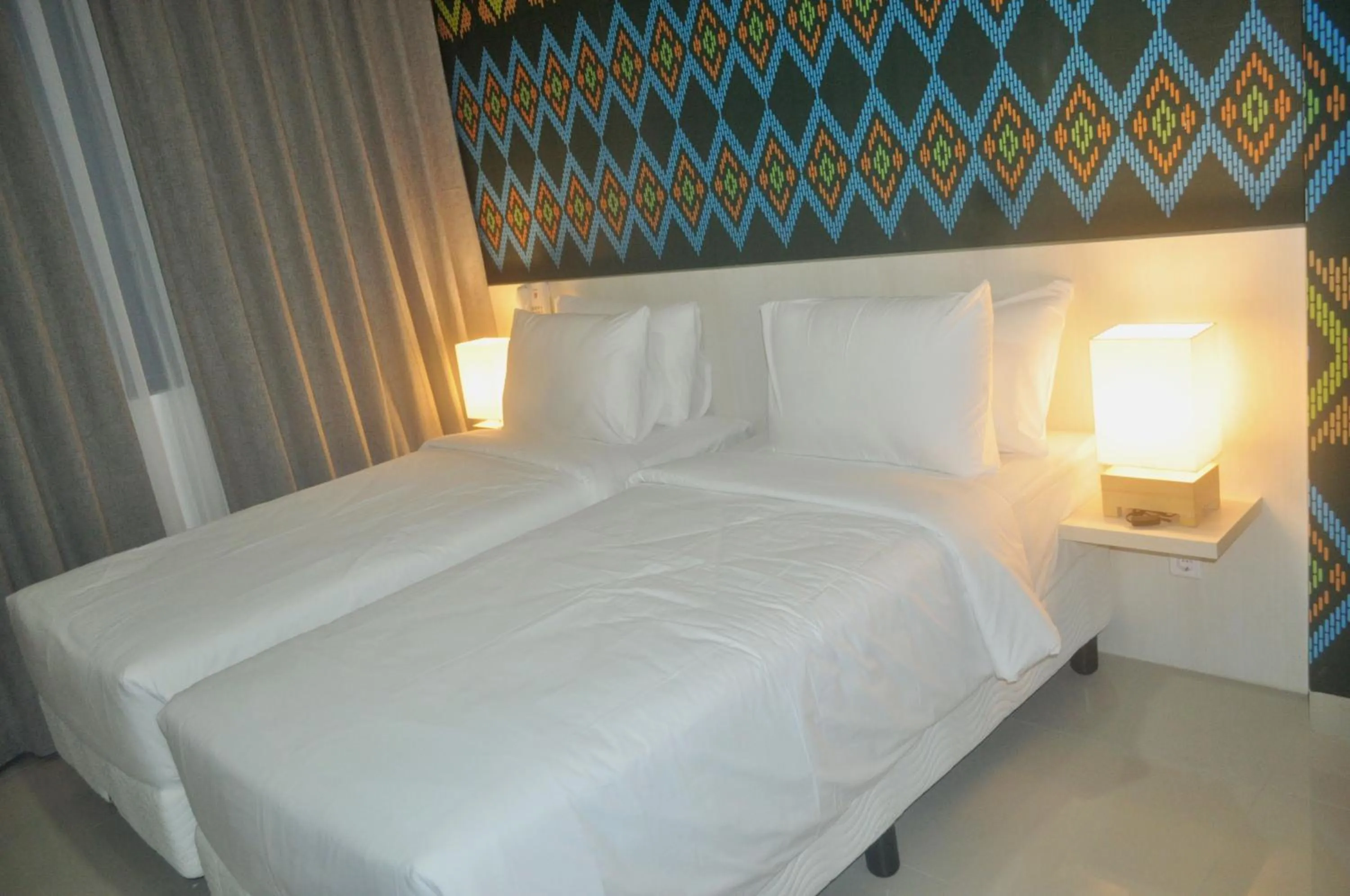 Bed in Alam Hotel by Cordela