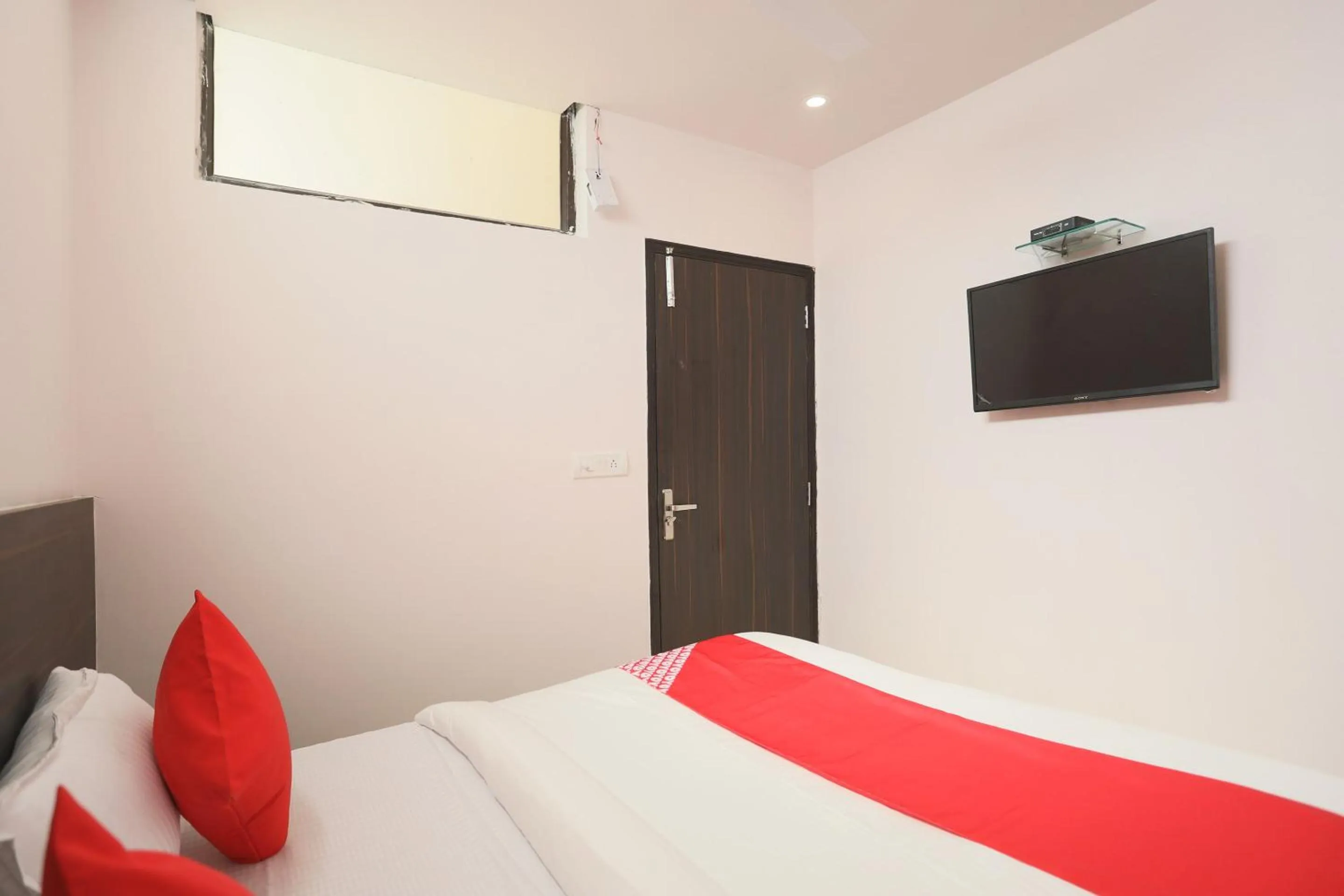 Bedroom in Hotel O DSG Residency