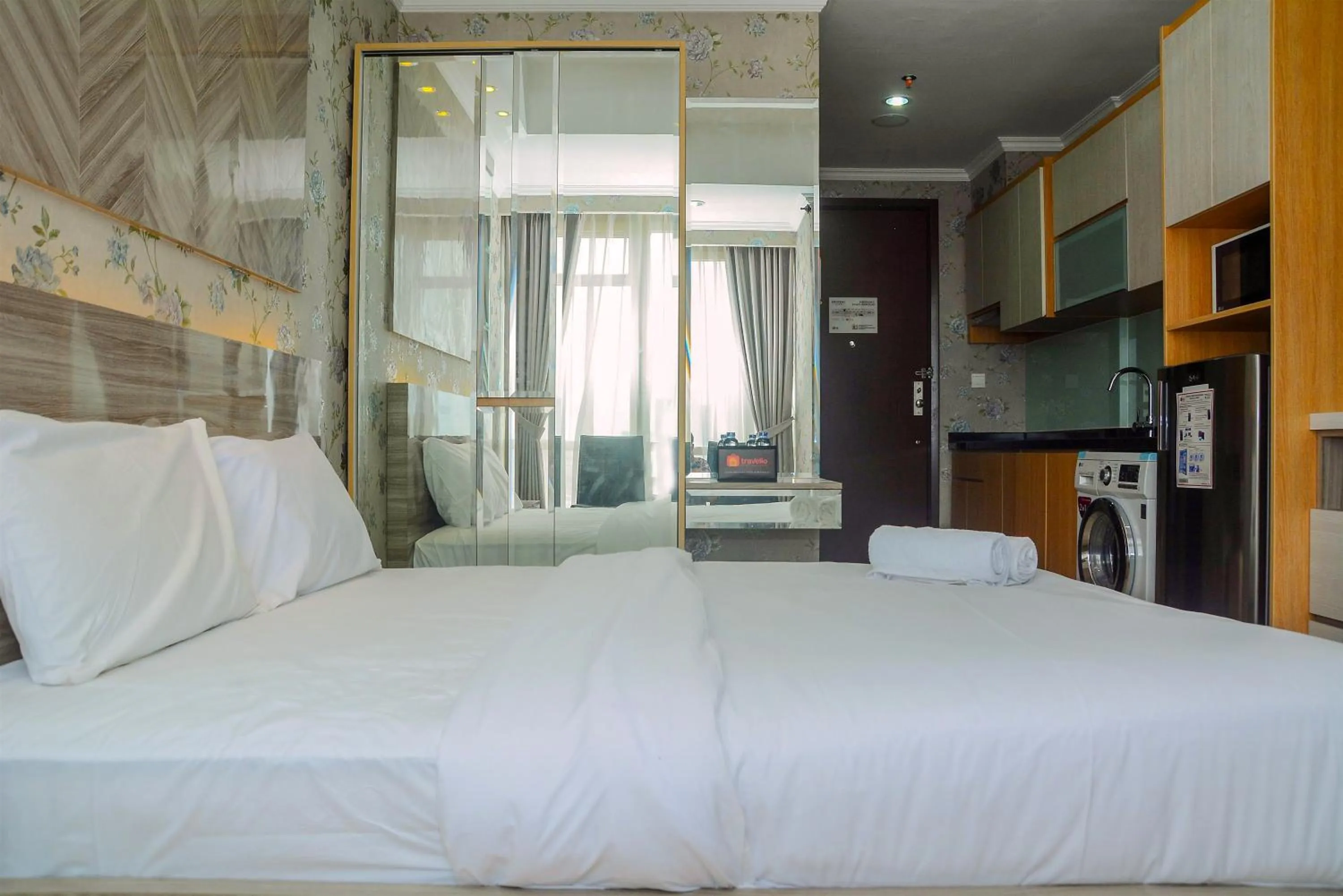 Bed in Tranquil Studio Apartment at Menteng Park By Travelio